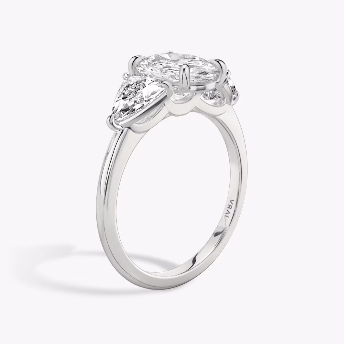 The Three Stone | Oval | 18k | White Gold | bandAccent: Plain | sideStoneCarat: 0.50ct | sideStoneShape: Trillion | diamondOrientation: vertical | caratWeight: other