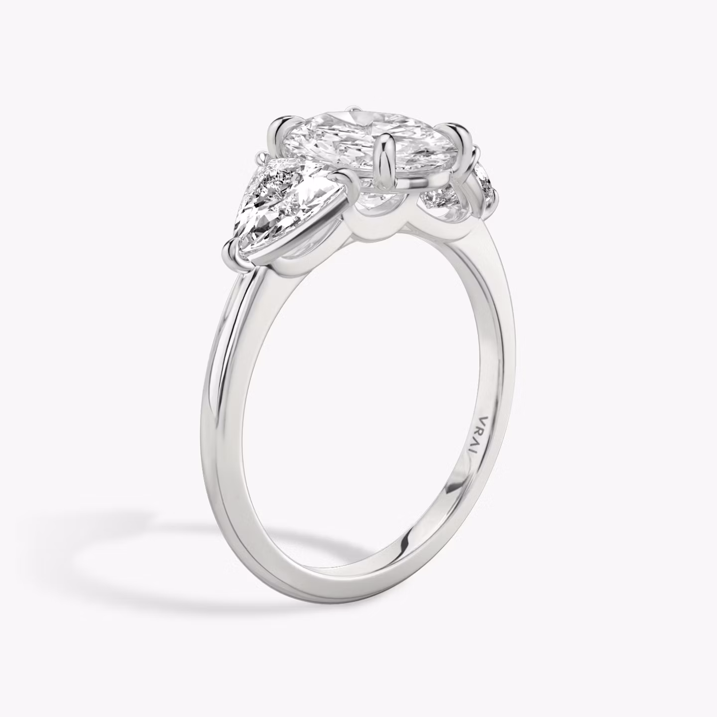 The Three Stone | Oval | 18k | White Gold | bandAccent: Plain | sideStoneCarat: 0.50ct | sideStoneShape: Trillion | diamondOrientation: vertical | caratWeight: other