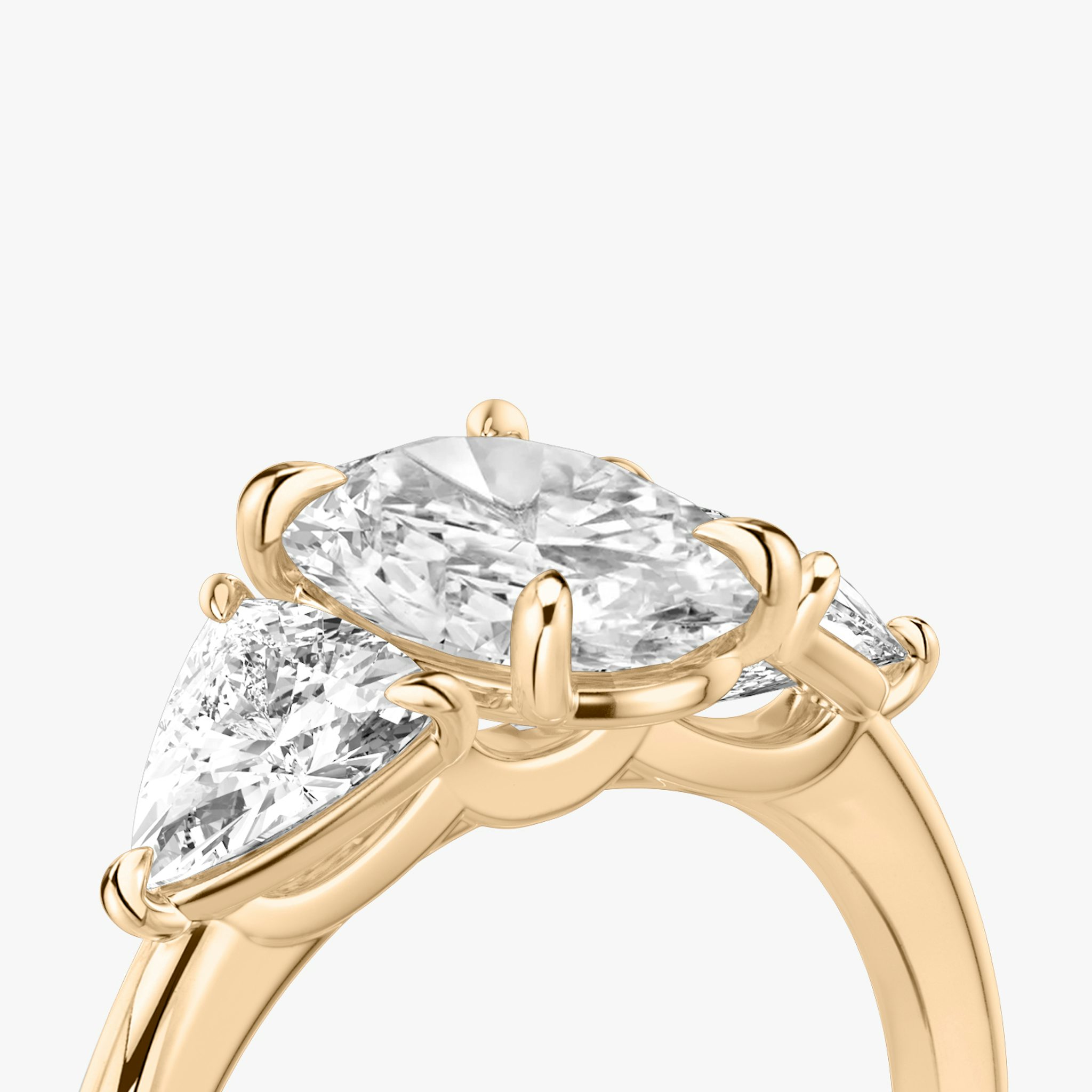 The Three Stone | Oval | 14k | Rose Gold | bandAccent: Plain | sideStoneCarat: 0.50ct | sideStoneShape: Trillion | diamondOrientation: vertical | caratWeight: other