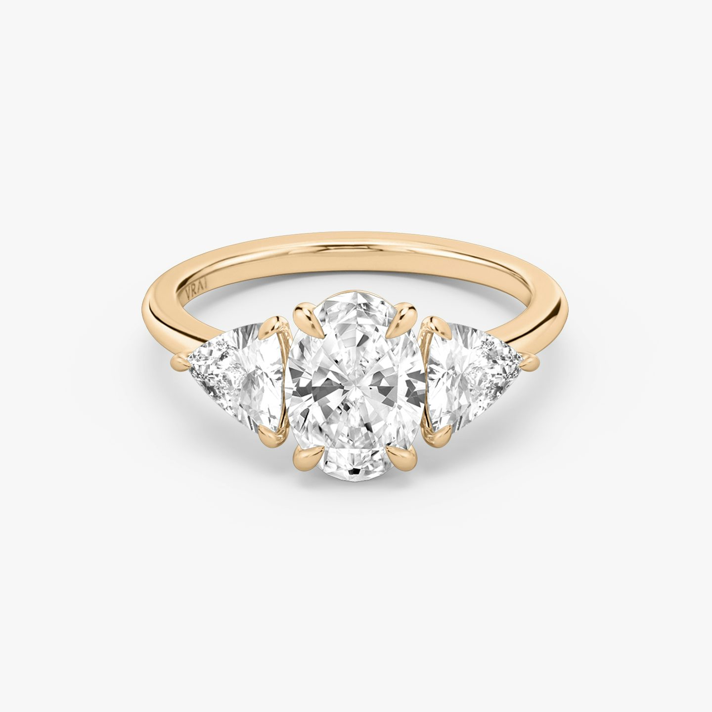 The Three Stone | Oval | 14k | Rose Gold | bandAccent: Plain | sideStoneCarat: 0.50ct | sideStoneShape: Trillion | diamondOrientation: vertical | caratWeight: other