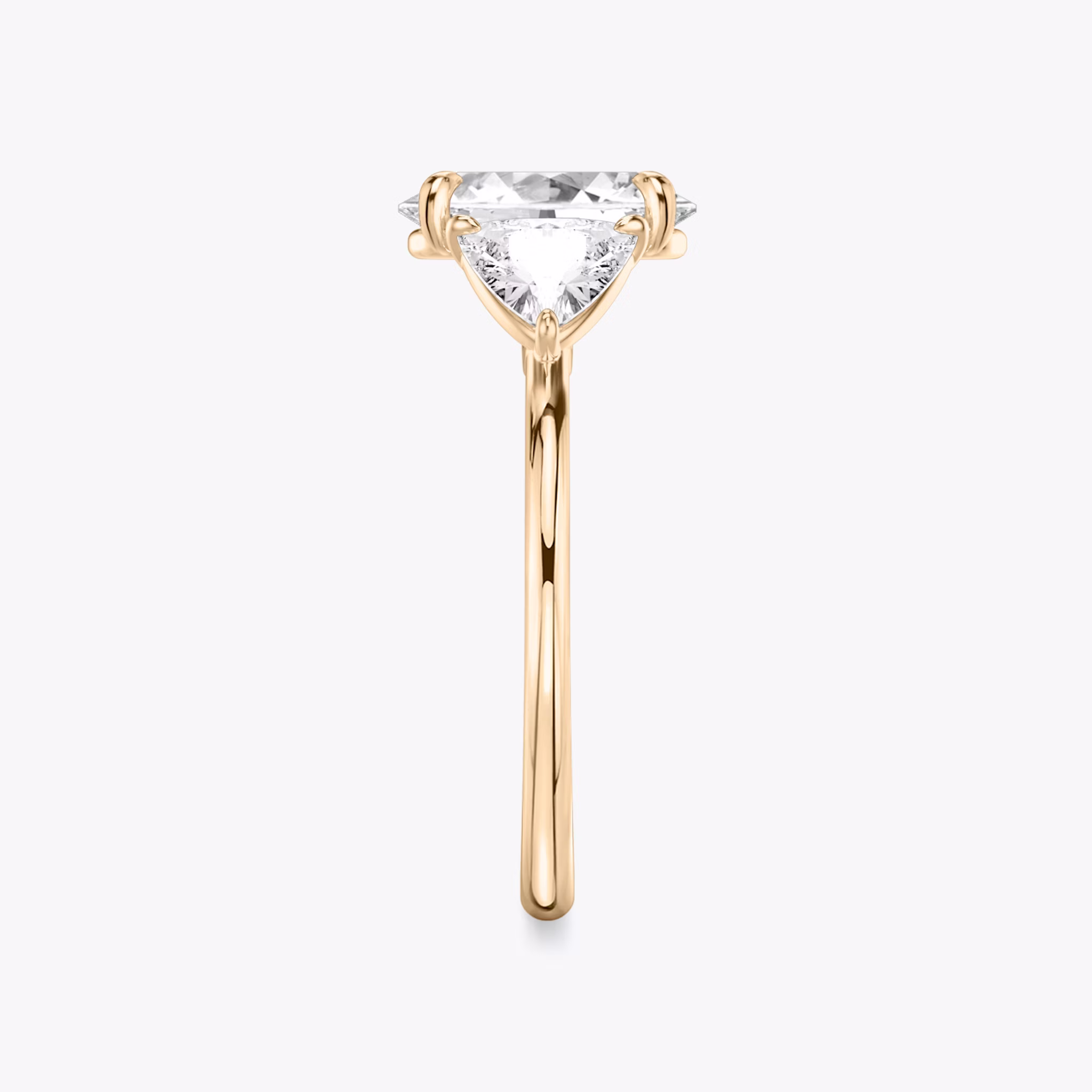 The Three Stone | Oval | 14k | Rose Gold | bandAccent: Plain | sideStoneCarat: 0.50ct | sideStoneShape: Trillion | diamondOrientation: vertical | caratWeight: other