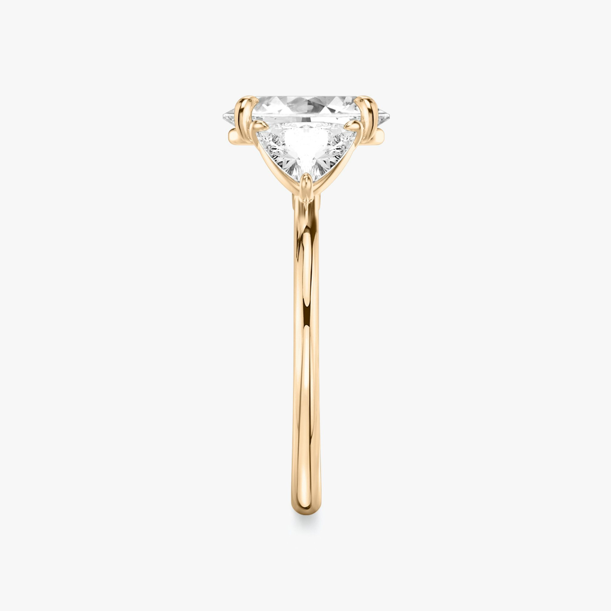 The Three Stone | Oval | 14k | Rose Gold | bandAccent: Plain | sideStoneCarat: 0.50ct | sideStoneShape: Trillion | diamondOrientation: vertical | caratWeight: other