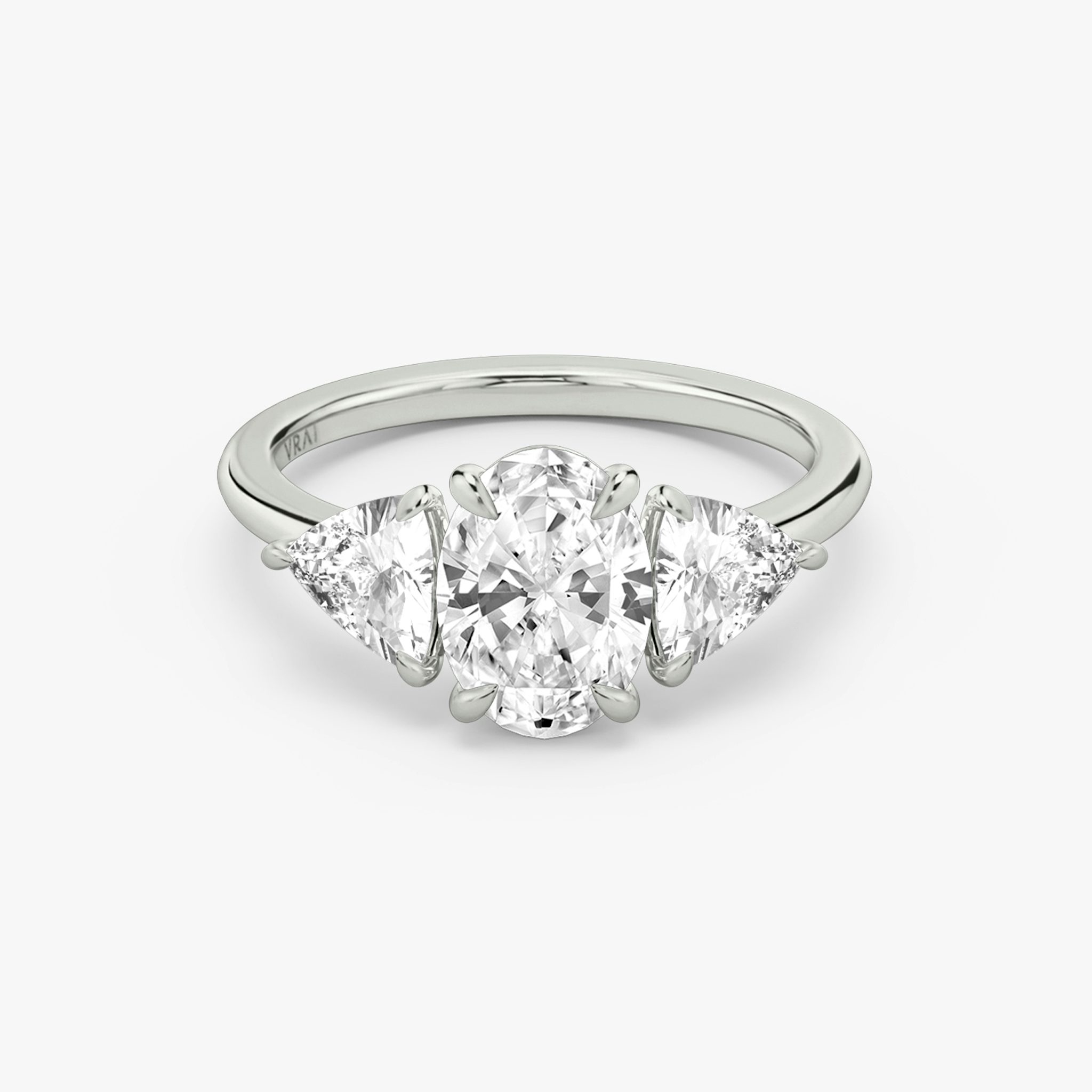 The Three Stone | Oval | Platinum | bandAccent: Plain | sideStoneCarat: 0.50ct | sideStoneShape: Trillion | diamondOrientation: vertical | caratWeight: other