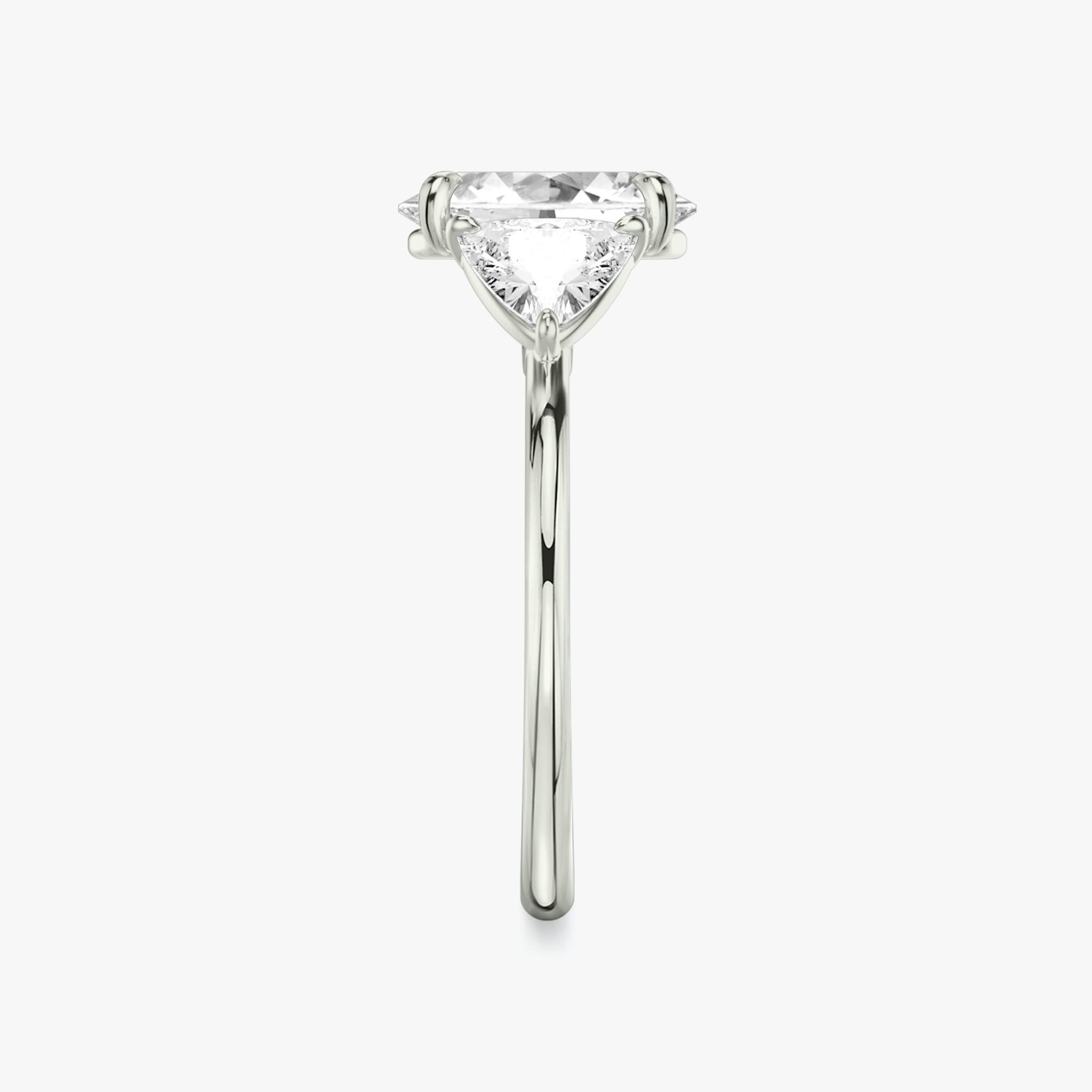 The Three Stone | Oval | Platinum | bandAccent: Plain | sideStoneCarat: 0.50ct | sideStoneShape: Trillion | diamondOrientation: vertical | caratWeight: other