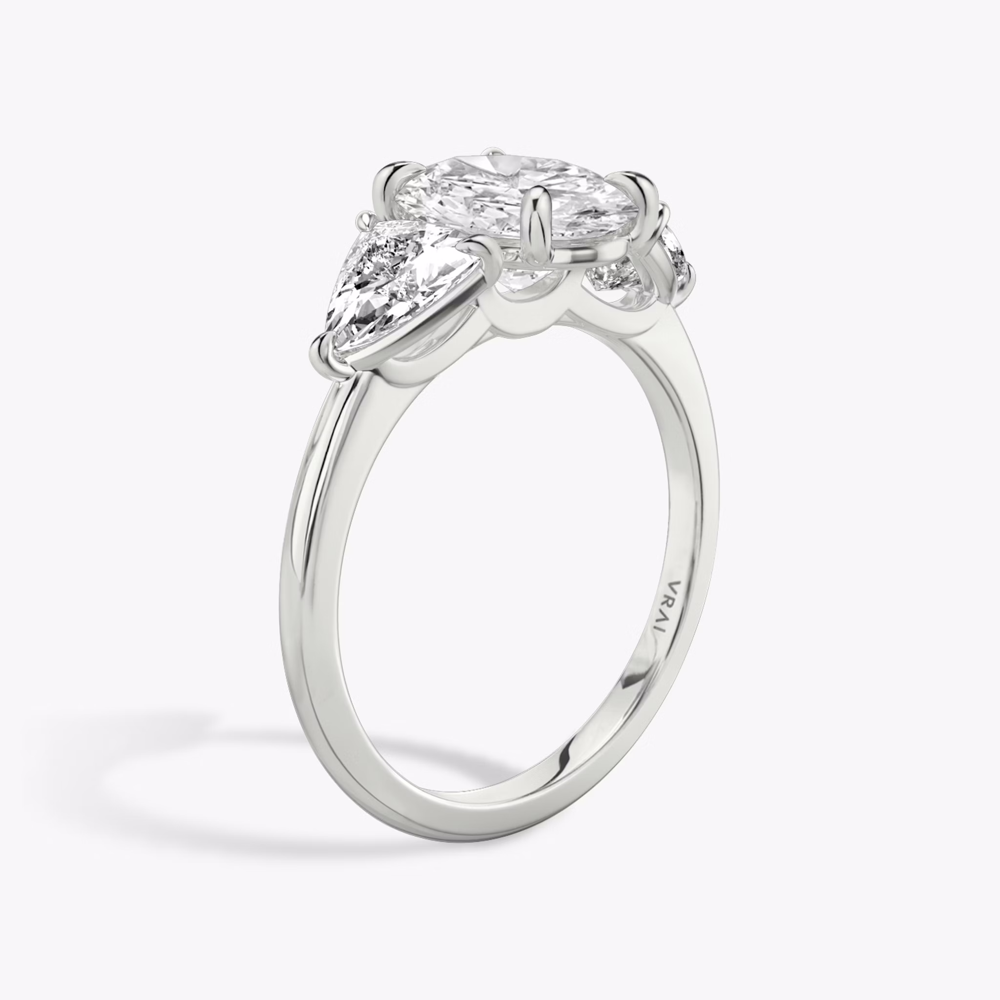 The Three Stone | Oval | Platinum | bandAccent: Plain | sideStoneCarat: 0.50ct | sideStoneShape: Trillion | diamondOrientation: vertical | caratWeight: other