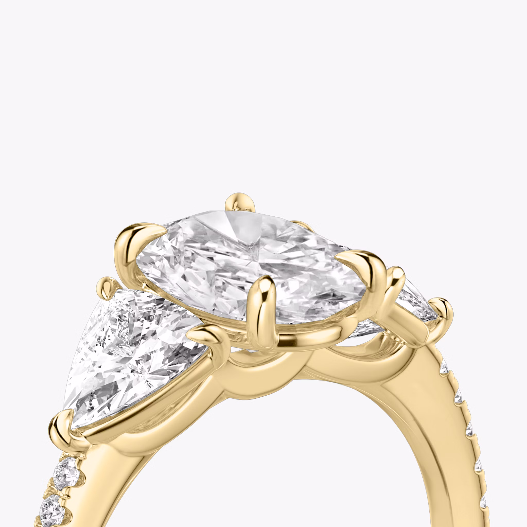 The Three Stone | Oval | 18k | Yellow Gold | bandAccent: Pavé | sideStoneCarat: 0.50ct | sideStoneShape: Trillion | diamondOrientation: vertical | caratWeight: other
