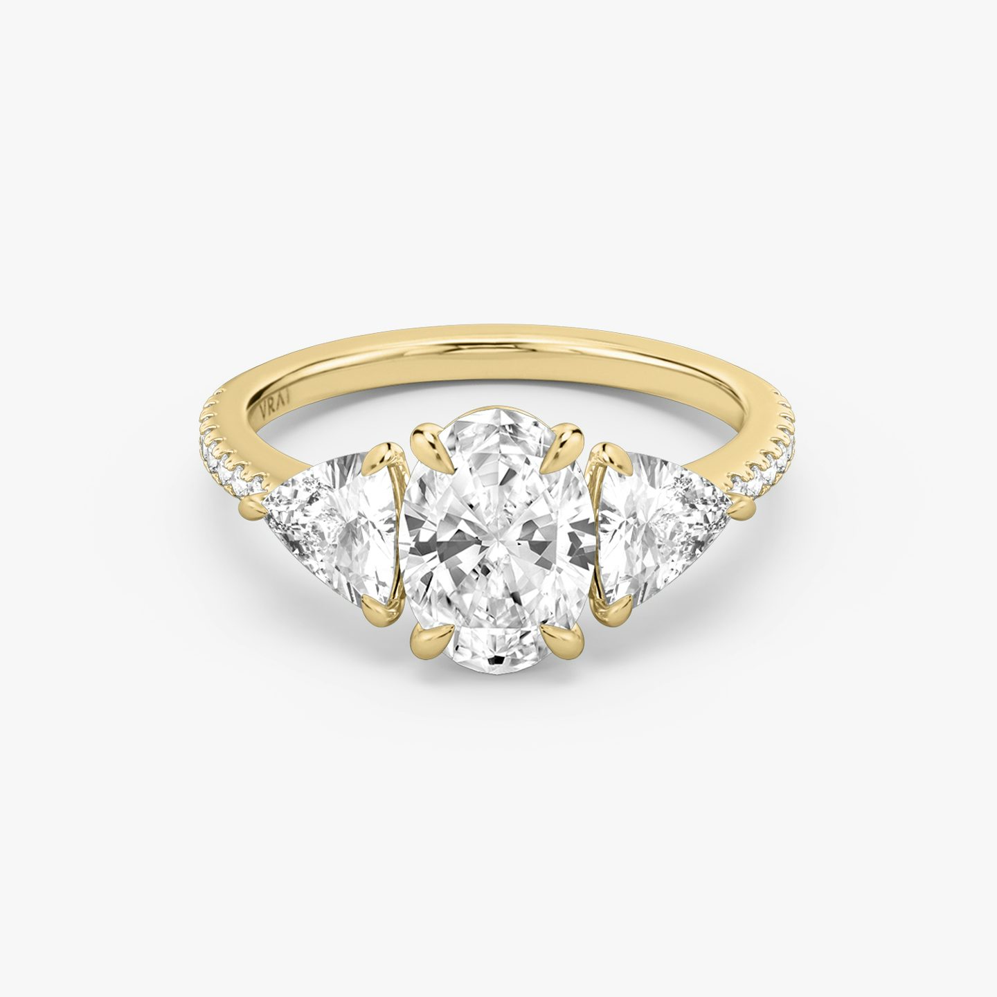 The Three Stone | Oval | 18k | Yellow Gold | bandAccent: Pavé | sideStoneCarat: 0.50ct | sideStoneShape: Trillion | diamondOrientation: vertical | caratWeight: other