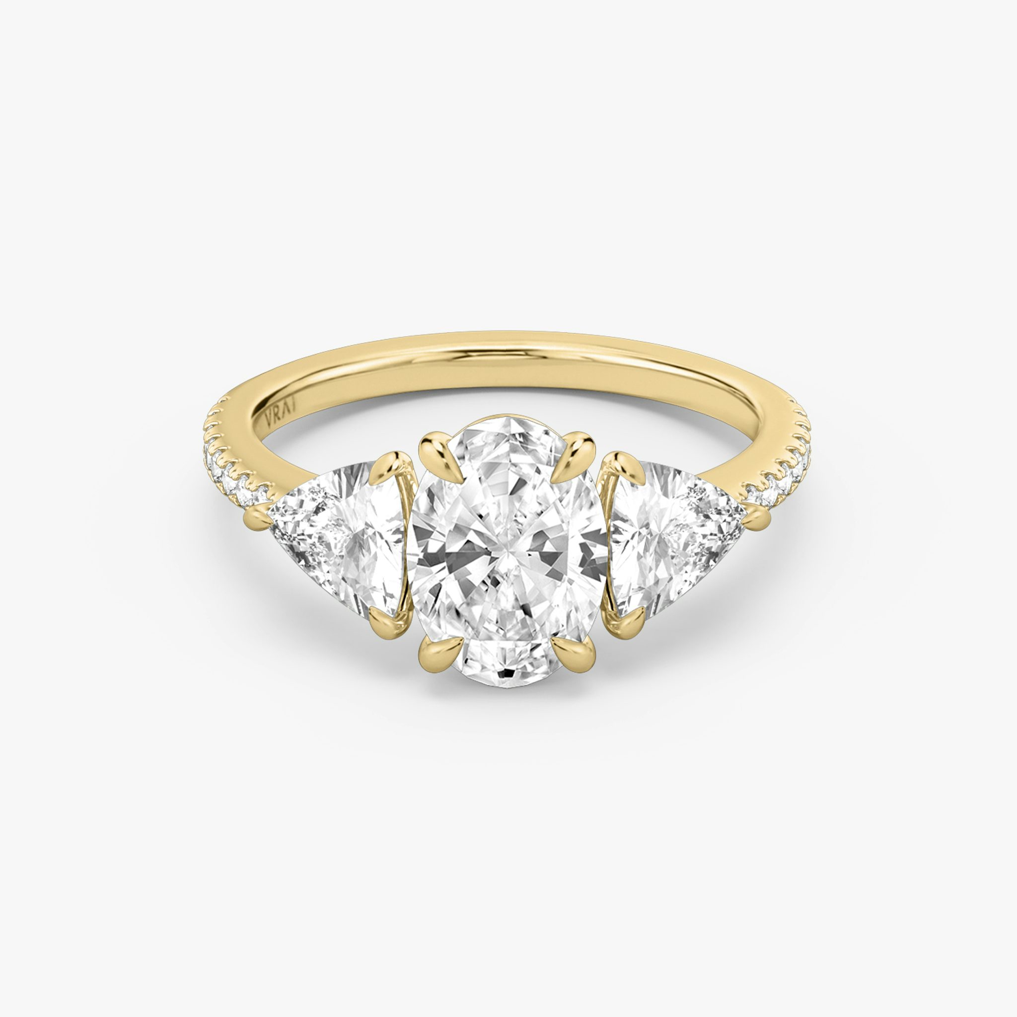 The Three Stone | Oval | 18k | Yellow Gold | bandAccent: Pavé | sideStoneCarat: 0.50ct | sideStoneShape: Trillion | diamondOrientation: vertical | caratWeight: other