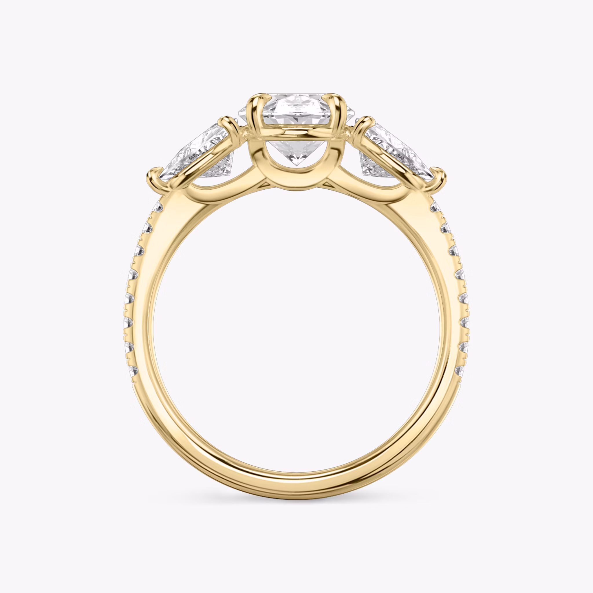 The Three Stone | Oval | 18k | Yellow Gold | bandAccent: Pavé | sideStoneCarat: 0.50ct | sideStoneShape: Trillion | diamondOrientation: vertical | caratWeight: other