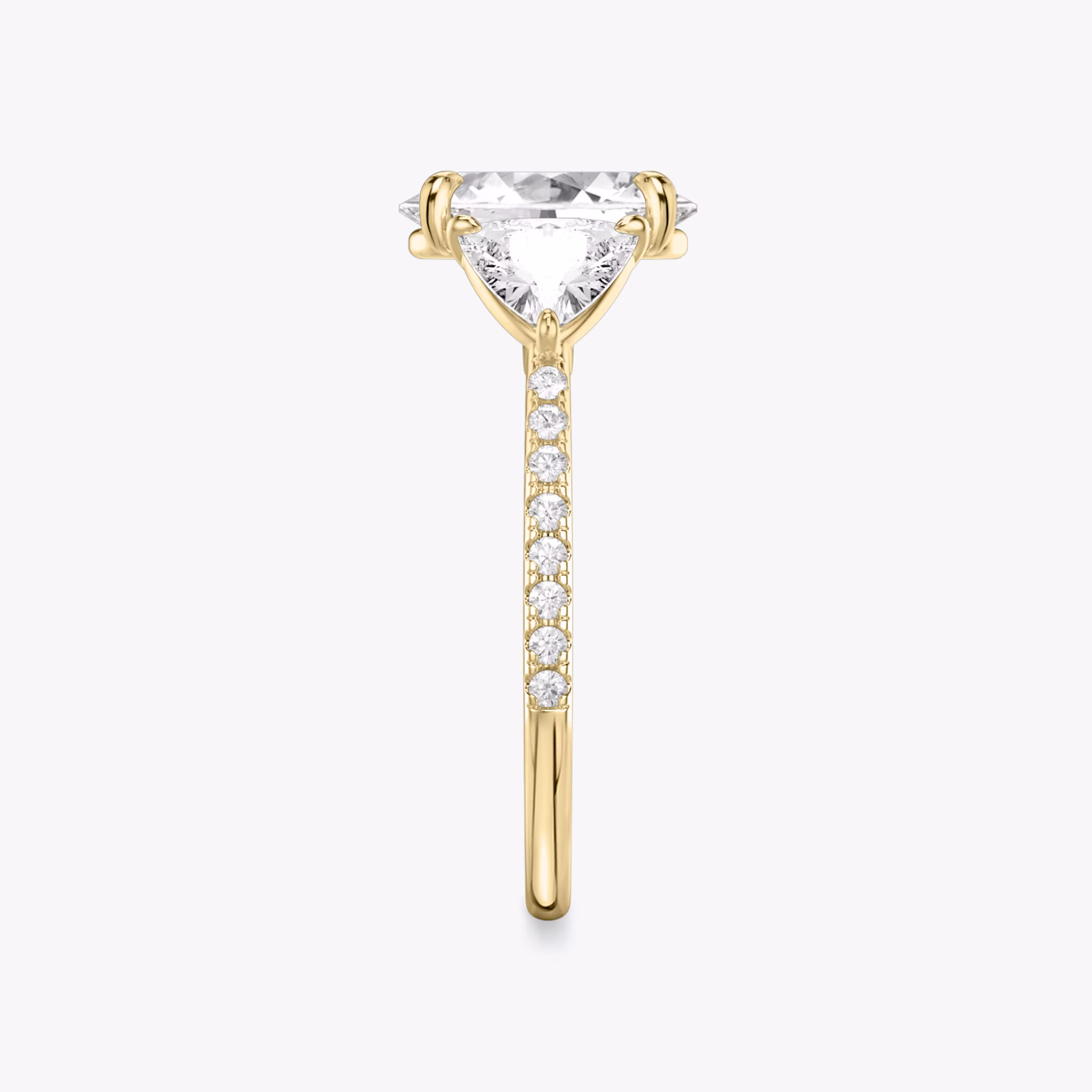 The Three Stone | Oval | 18k | Yellow Gold | bandAccent: Pavé | sideStoneCarat: 0.50ct | sideStoneShape: Trillion | diamondOrientation: vertical | caratWeight: other