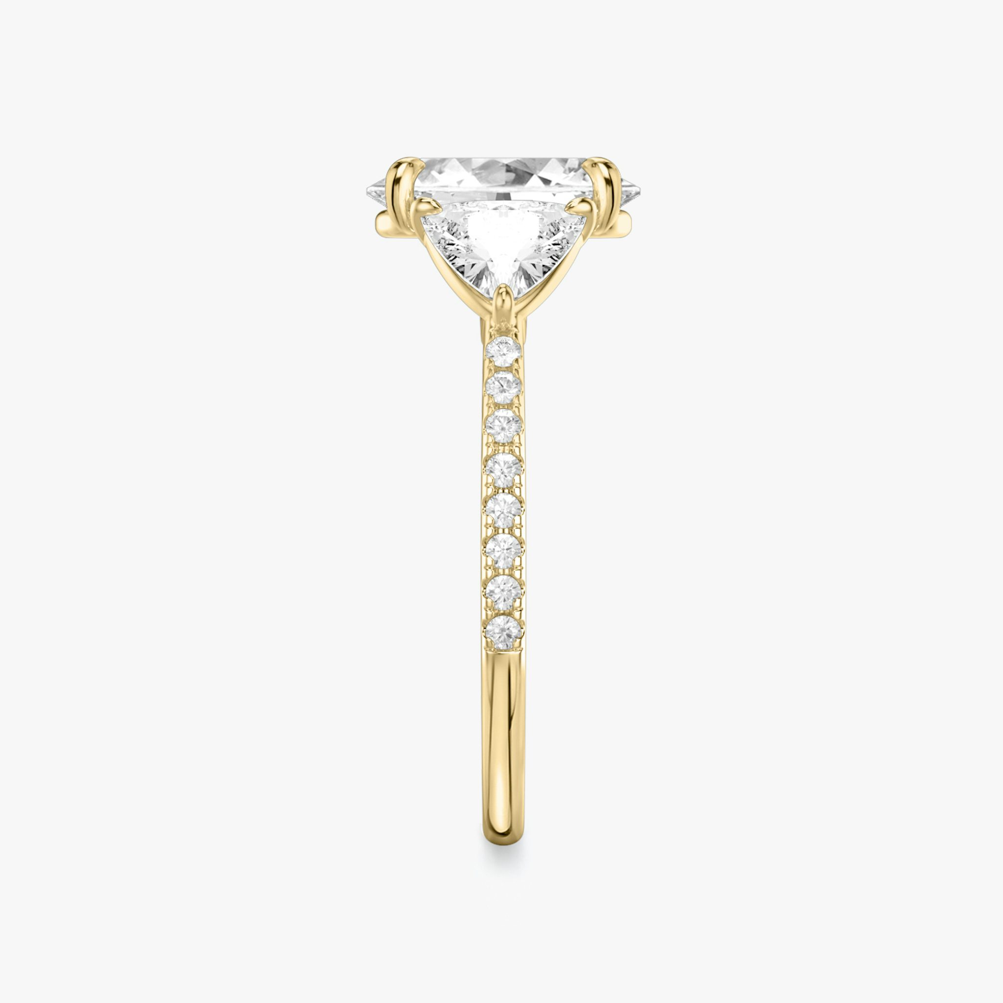 The Three Stone | Oval | 18k | Yellow Gold | bandAccent: Pavé | sideStoneCarat: 0.50ct | sideStoneShape: Trillion | diamondOrientation: vertical | caratWeight: other