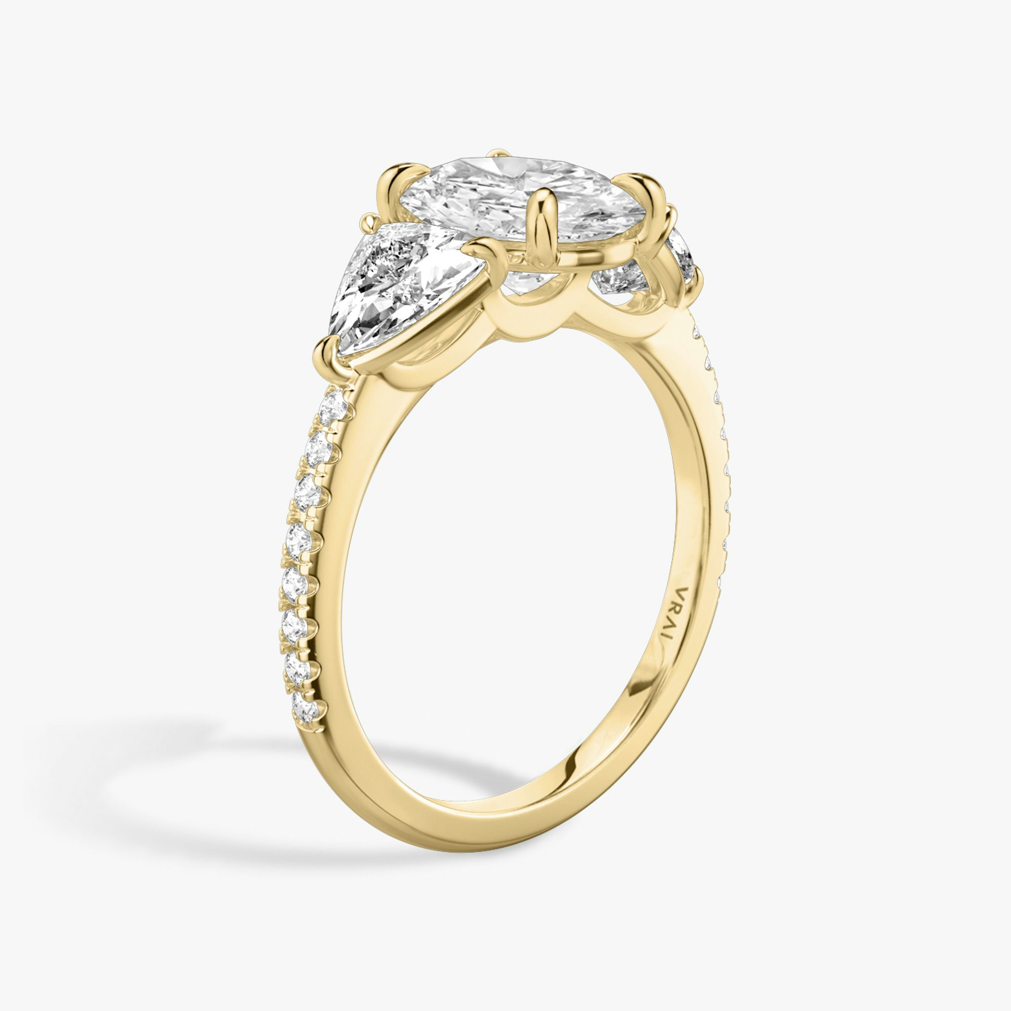 The Three Stone | Oval | 18k | Yellow Gold | bandAccent: Pavé | sideStoneCarat: 0.50ct | sideStoneShape: Trillion | diamondOrientation: vertical | caratWeight: other