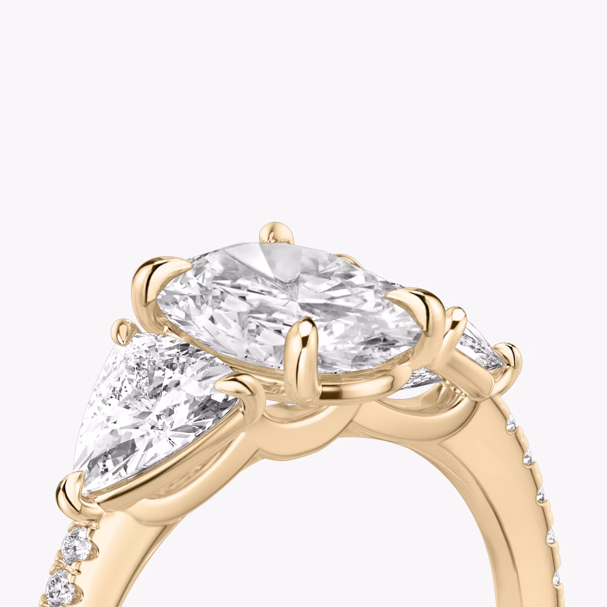 The Three Stone | Oval | 14k | Rose Gold | bandAccent: Pavé | sideStoneCarat: 0.50ct | sideStoneShape: Trillion | diamondOrientation: vertical | caratWeight: other