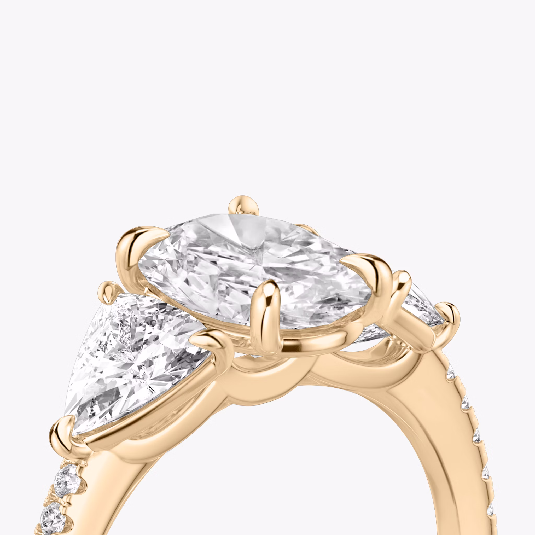 The Three Stone | Oval | 14k | Rose Gold | bandAccent: Pavé | sideStoneCarat: 0.50ct | sideStoneShape: Trillion | diamondOrientation: vertical | caratWeight: other