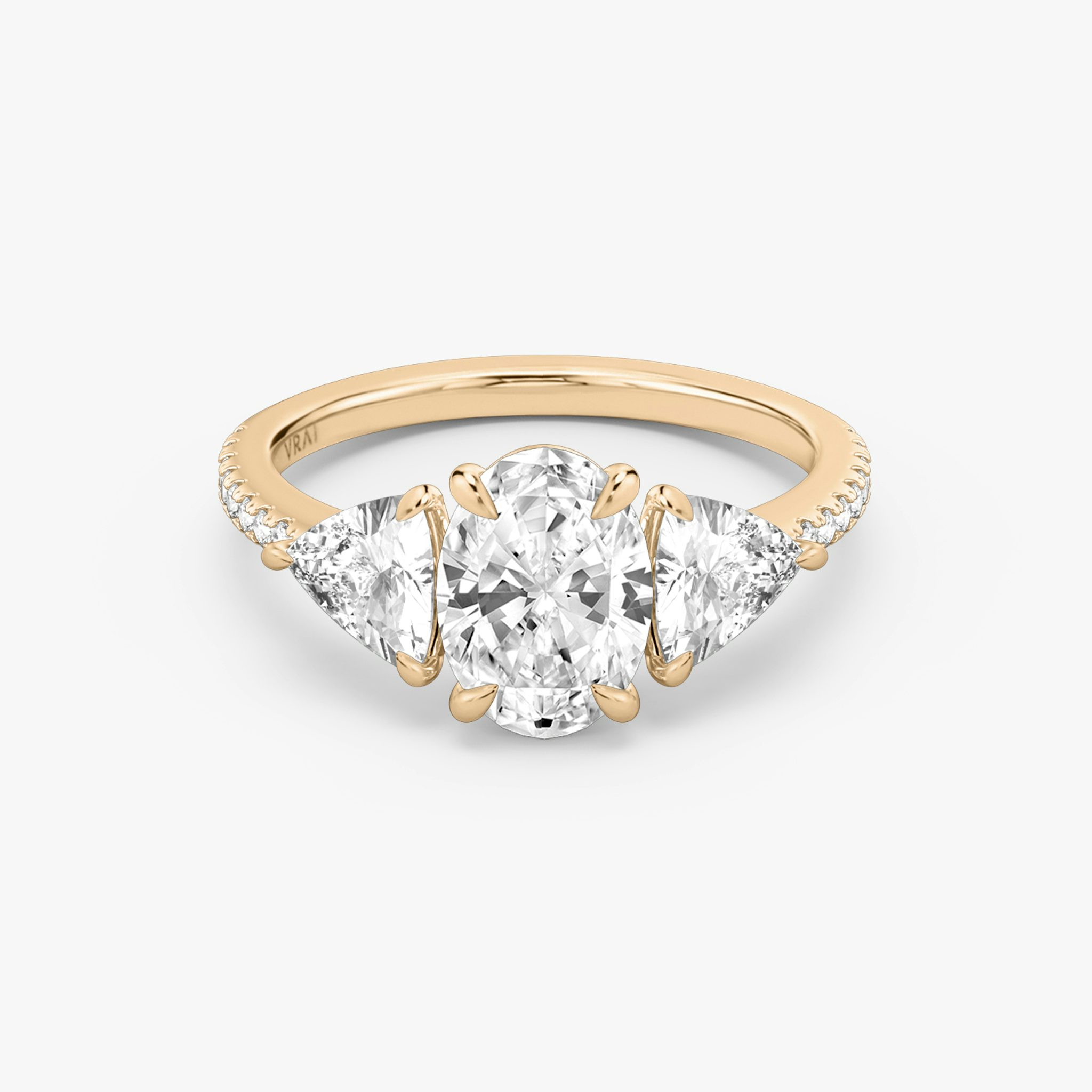 The Three Stone | Oval | 14k | Rose Gold | bandAccent: Pavé | sideStoneCarat: 0.50ct | sideStoneShape: Trillion | diamondOrientation: vertical | caratWeight: other