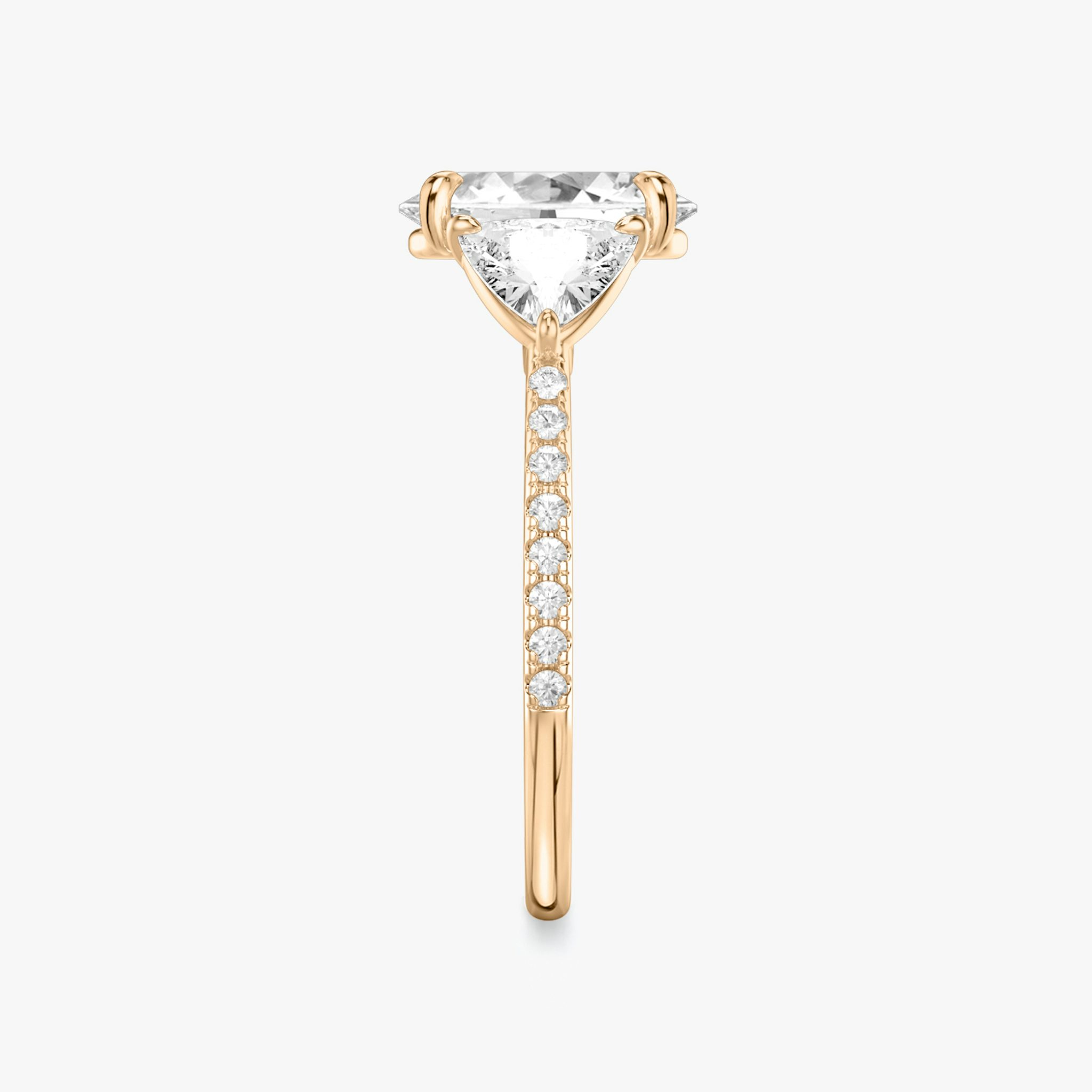 The Three Stone | Oval | 14k | Rose Gold | bandAccent: Pavé | sideStoneCarat: 0.50ct | sideStoneShape: Trillion | diamondOrientation: vertical | caratWeight: other