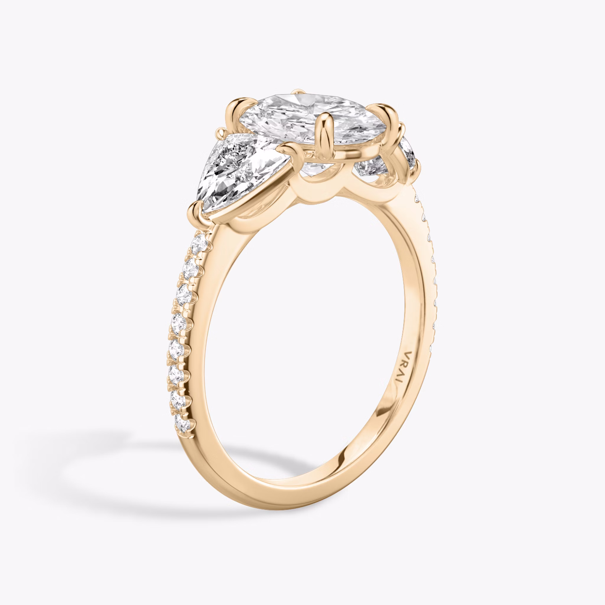 The Three Stone | Oval | 14k | Rose Gold | bandAccent: Pavé | sideStoneCarat: 0.50ct | sideStoneShape: Trillion | diamondOrientation: vertical | caratWeight: other