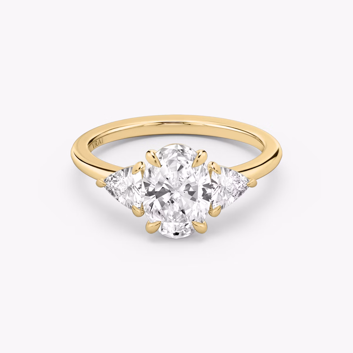 The Three Stone | Oval | 18k | Yellow Gold | bandAccent: Plain | sideStoneCarat: 0.25ct | sideStoneShape: Trillion | diamondOrientation: vertical | caratWeight: other