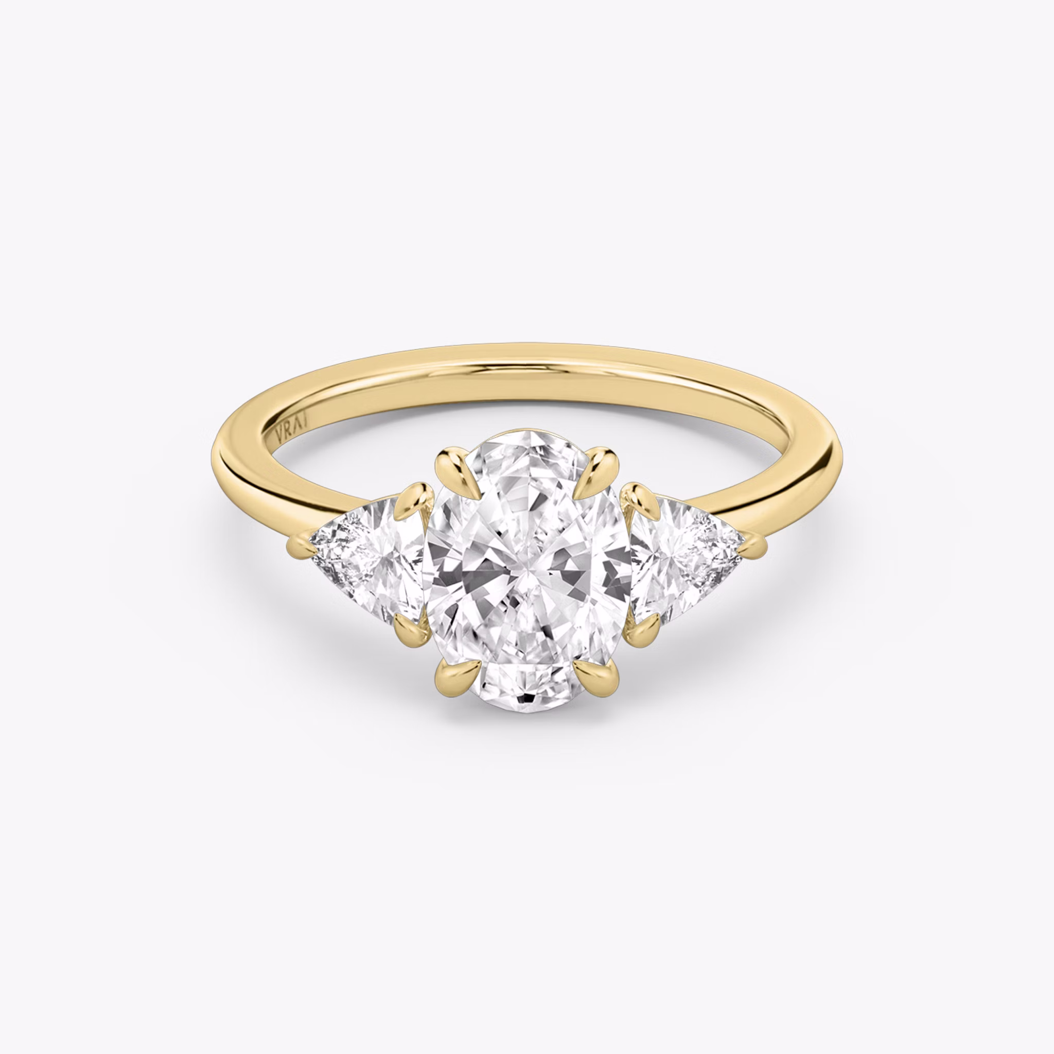 The Three Stone | Oval | 18k | Yellow Gold | bandAccent: Plain | sideStoneCarat: 0.25ct | sideStoneShape: Trillion | diamondOrientation: vertical | caratWeight: other