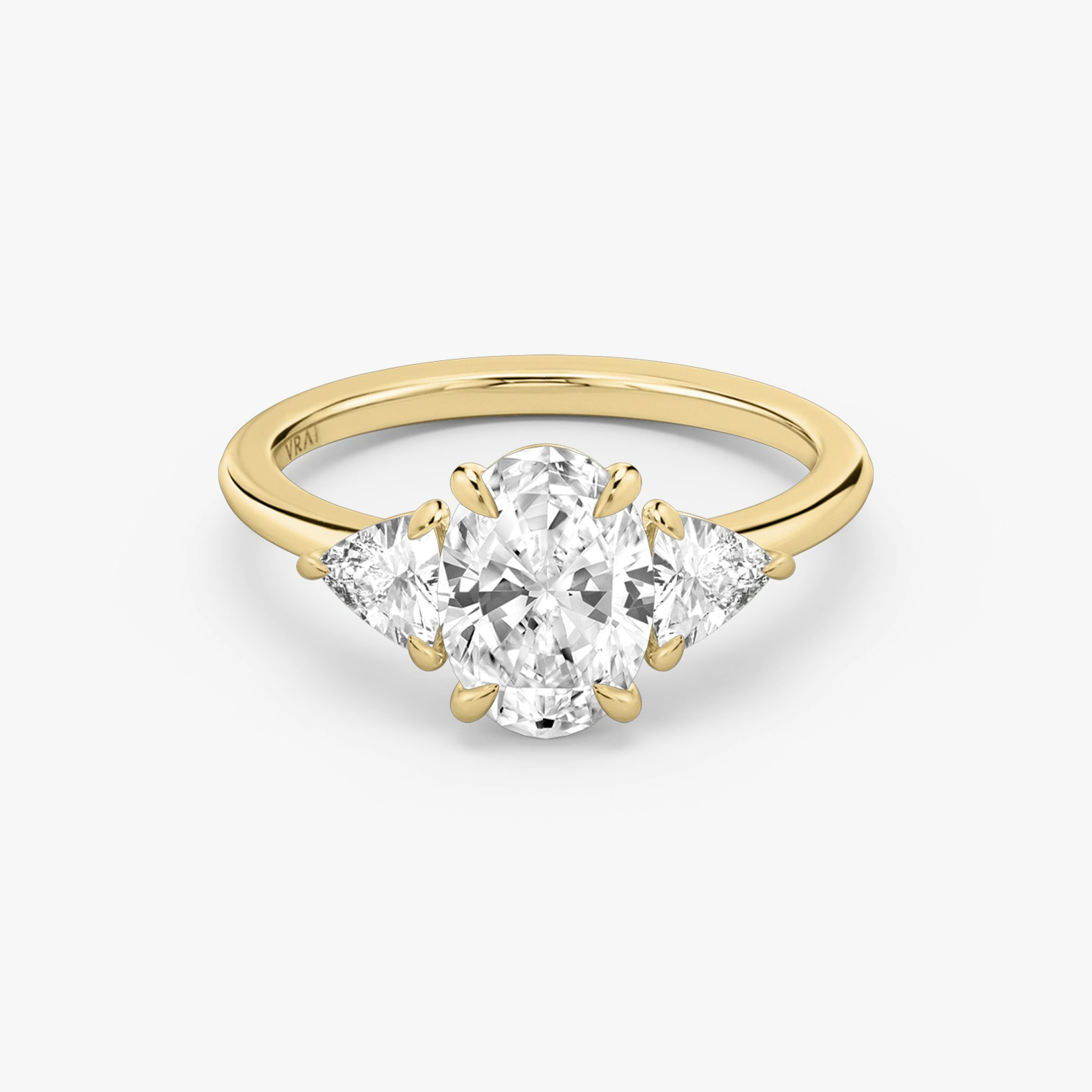 The Three Stone | Oval | 18k | Yellow Gold | bandAccent: Plain | sideStoneCarat: 0.25ct | sideStoneShape: Trillion | diamondOrientation: vertical | caratWeight: other
