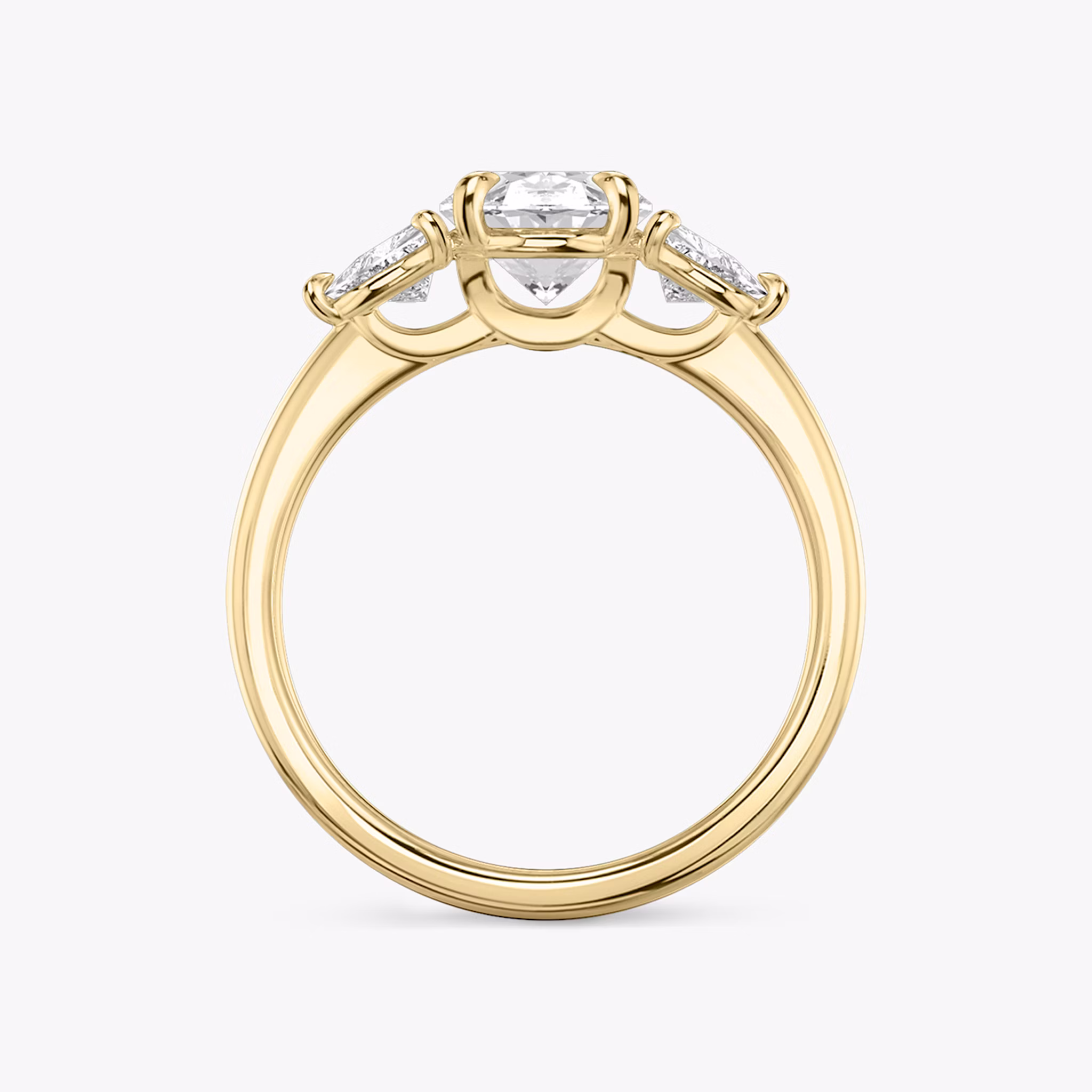 The Three Stone | Oval | 18k | Yellow Gold | bandAccent: Plain | sideStoneCarat: 0.25ct | sideStoneShape: Trillion | diamondOrientation: vertical | caratWeight: other