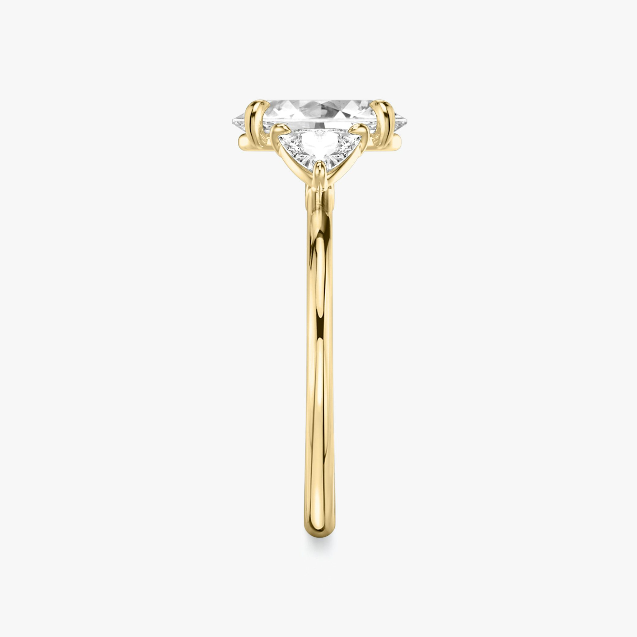 The Three Stone | Oval | 18k | Yellow Gold | bandAccent: Plain | sideStoneCarat: 0.25ct | sideStoneShape: Trillion | diamondOrientation: vertical | caratWeight: other
