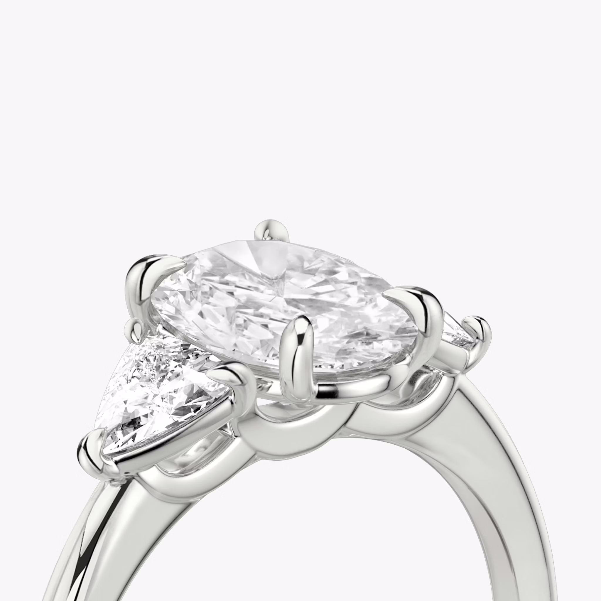 The Three Stone | Oval | 18k | White Gold | bandAccent: Plain | sideStoneCarat: 0.25ct | sideStoneShape: Trillion | diamondOrientation: vertical | caratWeight: other