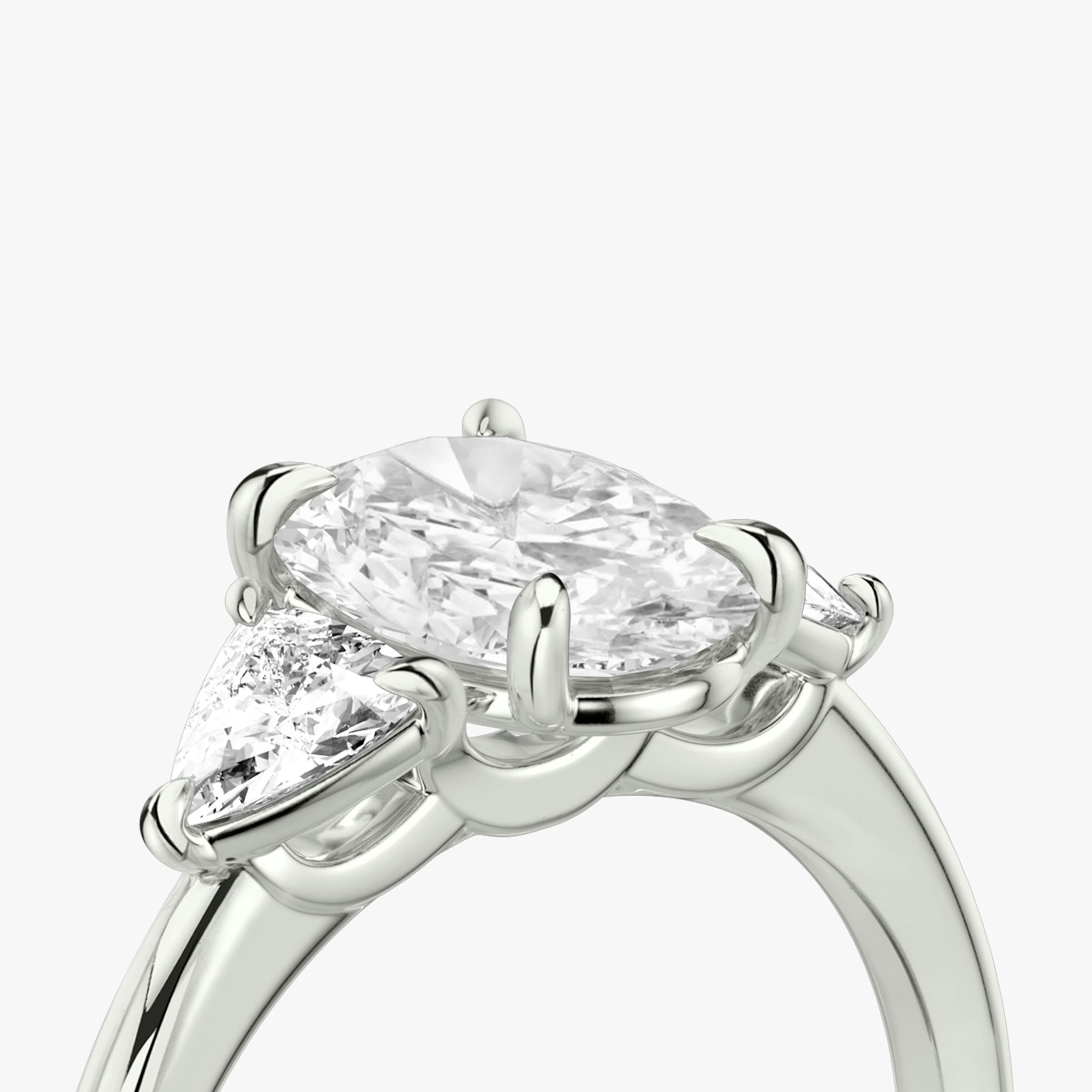The Three Stone | Oval | 18k | White Gold | bandAccent: Plain | sideStoneCarat: 0.25ct | sideStoneShape: Trillion | diamondOrientation: vertical | caratWeight: other