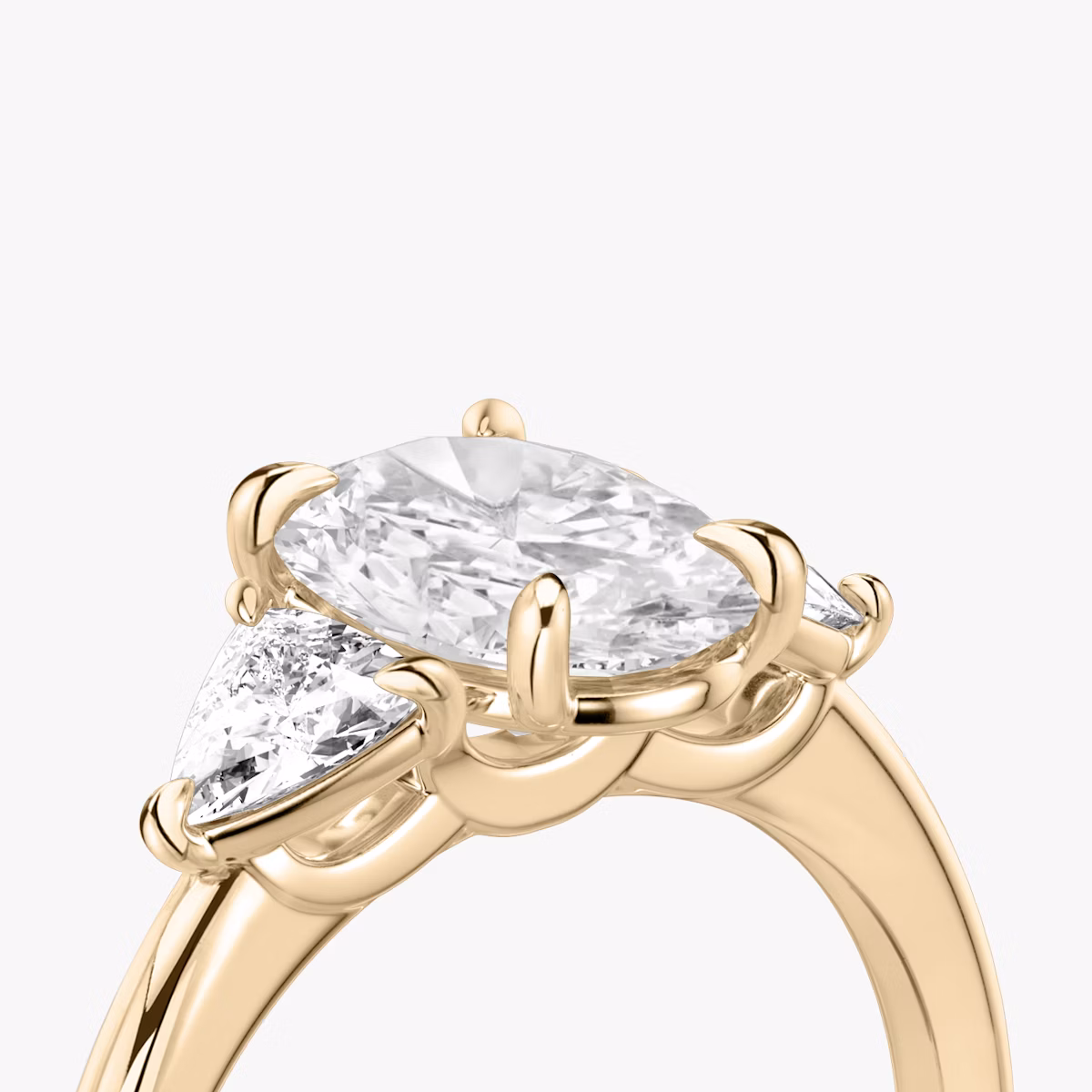 The Three Stone | Oval | 14k | Rose Gold | bandAccent: Plain | sideStoneCarat: 0.25ct | sideStoneShape: Trillion | diamondOrientation: vertical | caratWeight: other