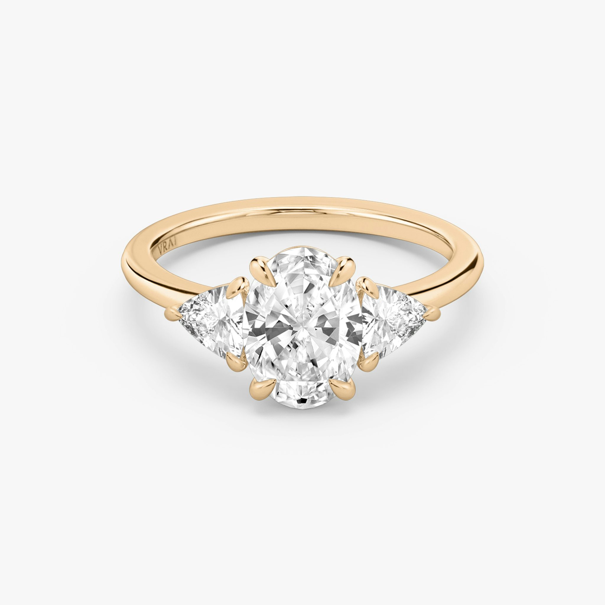 The Three Stone | Oval | 14k | Rose Gold | bandAccent: Plain | sideStoneCarat: 0.25ct | sideStoneShape: Trillion | diamondOrientation: vertical | caratWeight: other