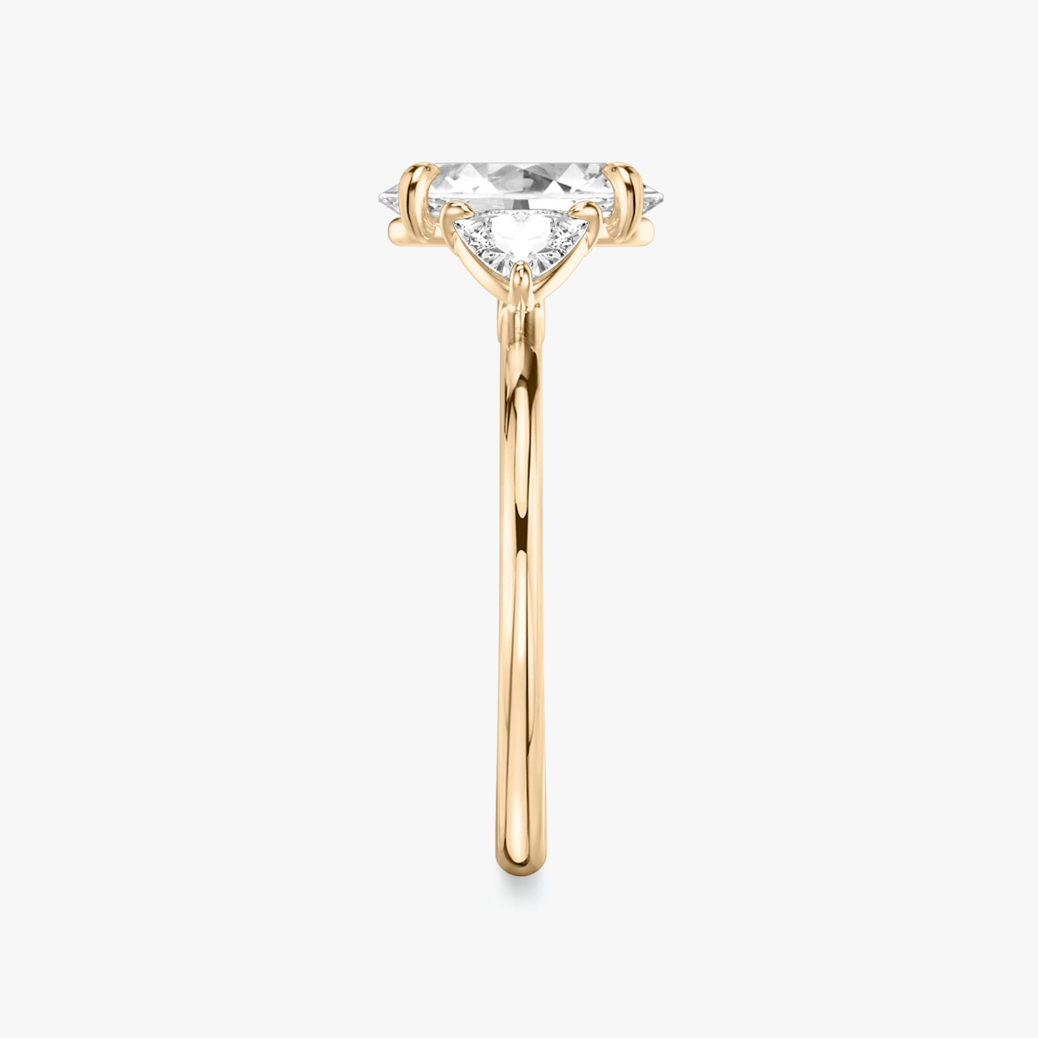 The Three Stone | Oval | 14k | Rose Gold | bandAccent: Plain | sideStoneCarat: 0.25ct | sideStoneShape: Trillion | diamondOrientation: vertical | caratWeight: other