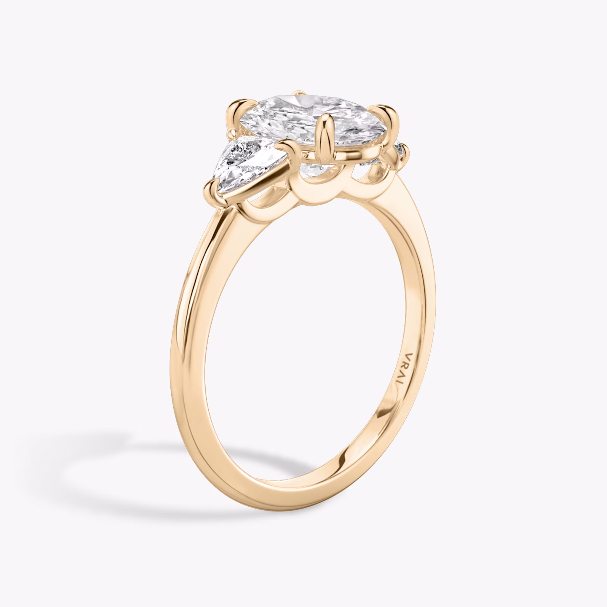 The Three Stone | Oval | 14k | Rose Gold | bandAccent: Plain | sideStoneCarat: 0.25ct | sideStoneShape: Trillion | diamondOrientation: vertical | caratWeight: other