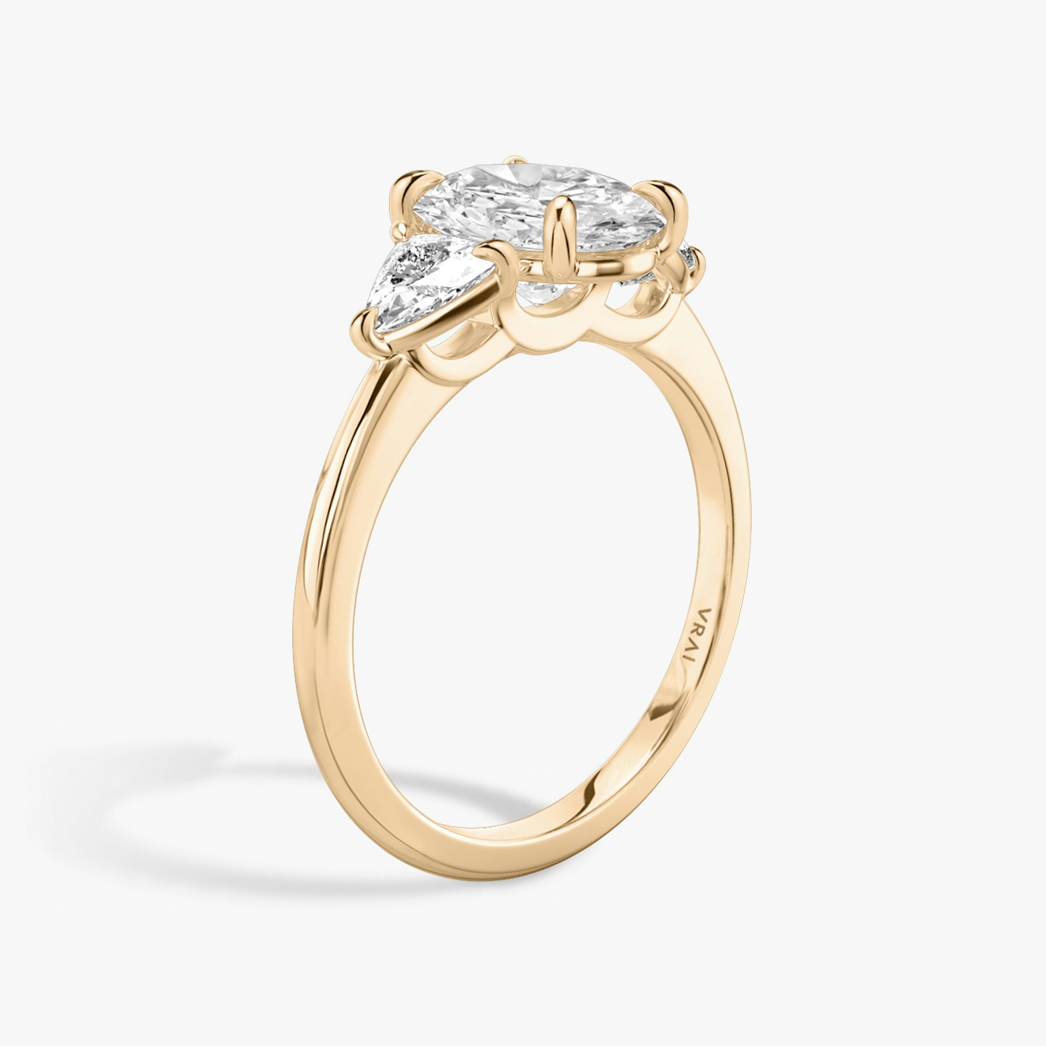 The Three Stone | Oval | 14k | Rose Gold | bandAccent: Plain | sideStoneCarat: 0.25ct | sideStoneShape: Trillion | diamondOrientation: vertical | caratWeight: other