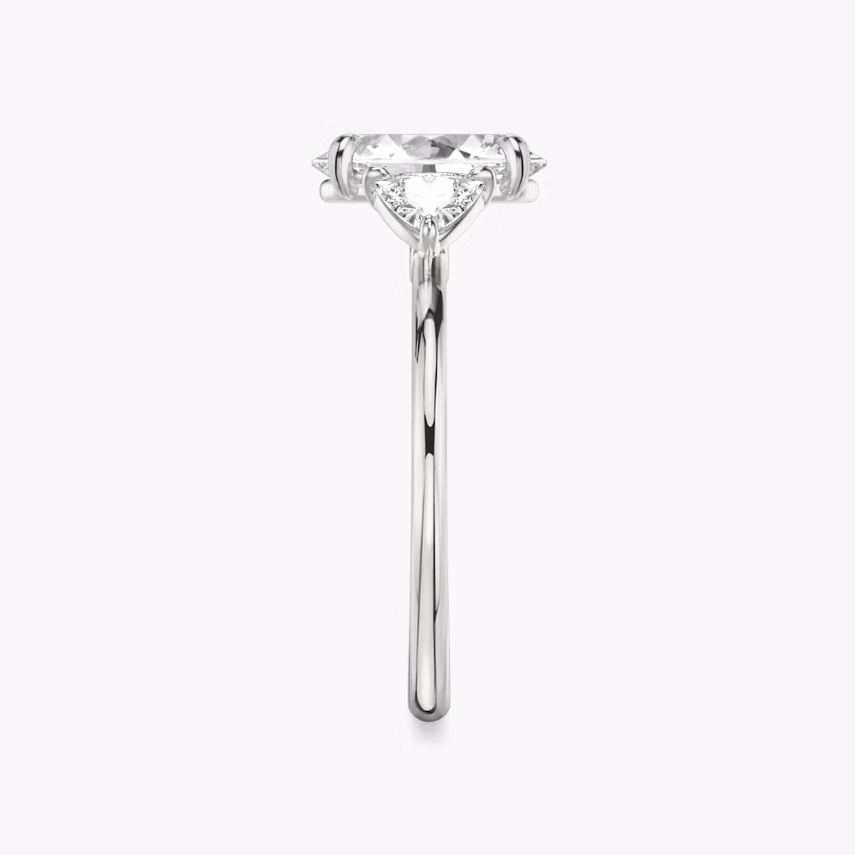 The Three Stone | Oval | Platinum | bandAccent: Plain | sideStoneCarat: 0.25ct | sideStoneShape: Trillion | diamondOrientation: vertical | caratWeight: other