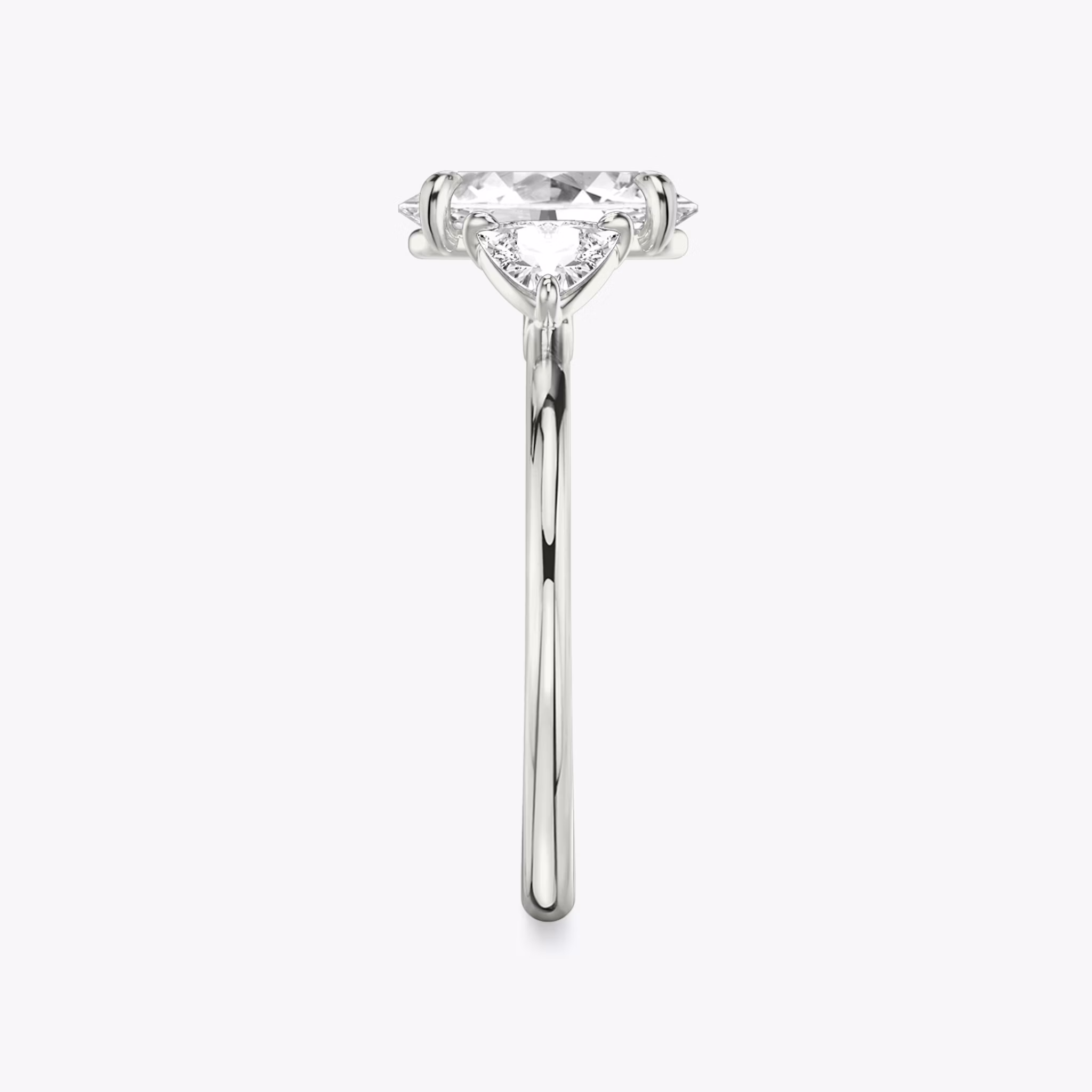 The Three Stone | Oval | Platinum | bandAccent: Plain | sideStoneCarat: 0.25ct | sideStoneShape: Trillion | diamondOrientation: vertical | caratWeight: other