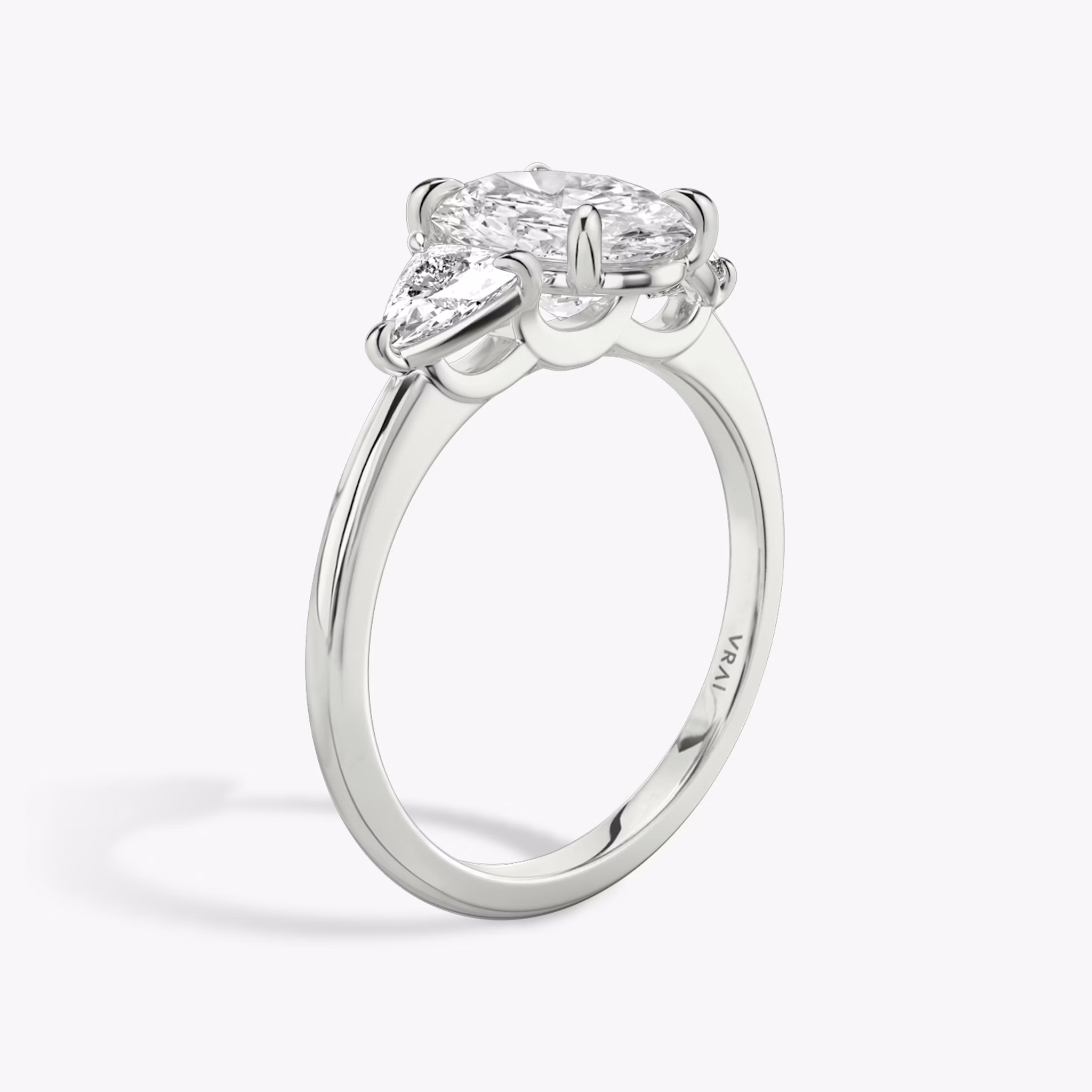 The Three Stone | Oval | Platinum | bandAccent: Plain | sideStoneCarat: 0.25ct | sideStoneShape: Trillion | diamondOrientation: vertical | caratWeight: other