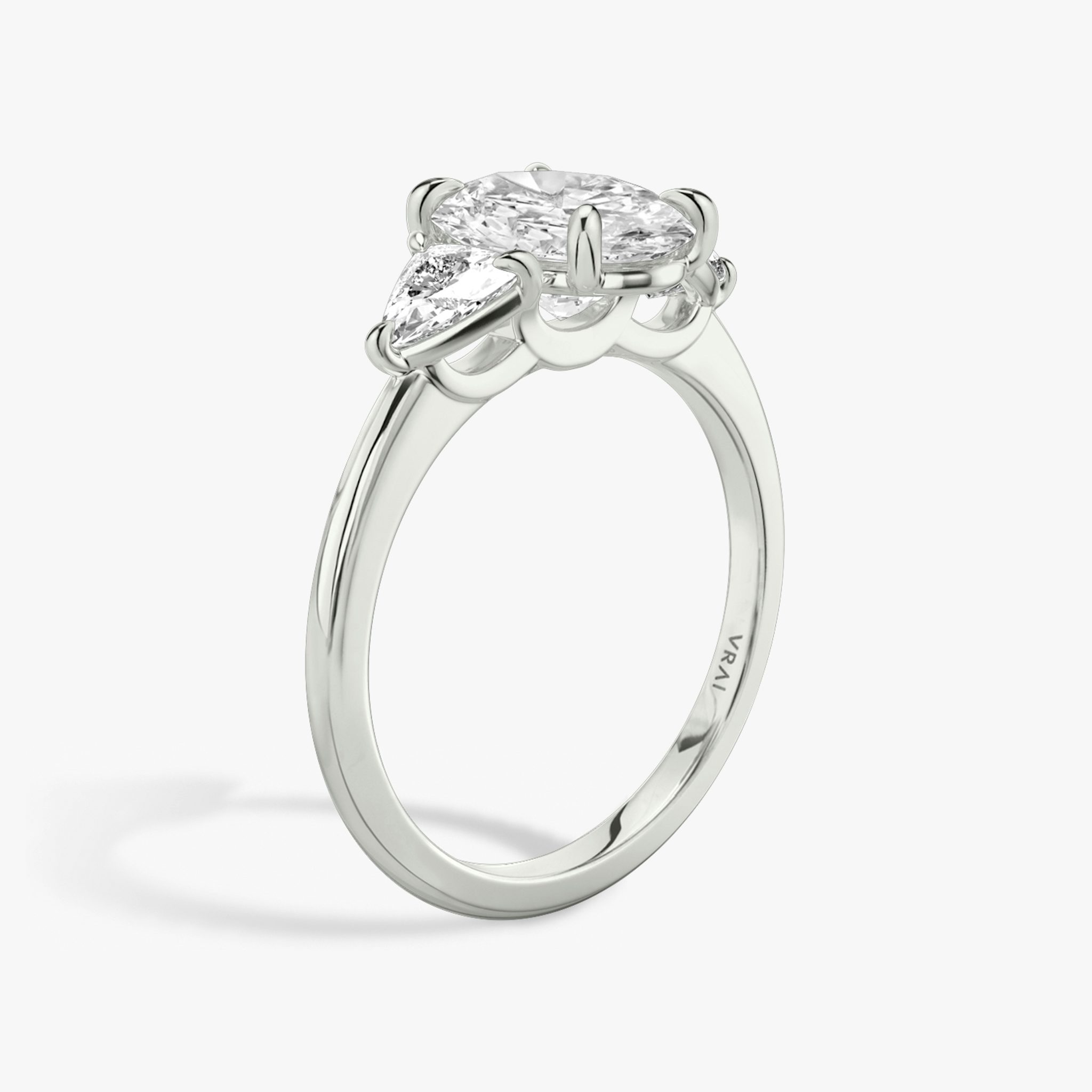 The Three Stone | Oval | Platinum | bandAccent: Plain | sideStoneCarat: 0.25ct | sideStoneShape: Trillion | diamondOrientation: vertical | caratWeight: other