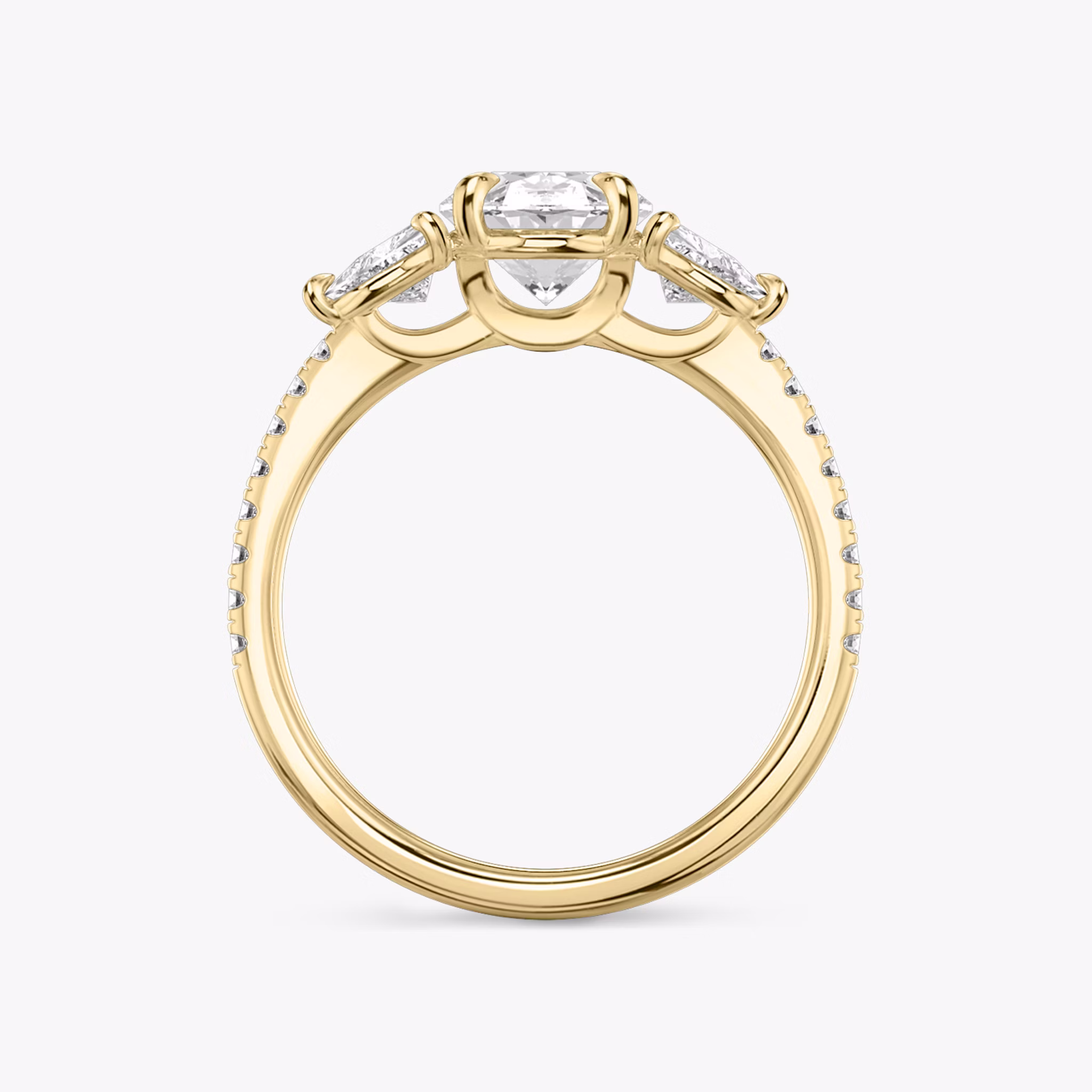 The Three Stone | Oval | 18k | Yellow Gold | bandAccent: Pavé | sideStoneCarat: 0.25ct | sideStoneShape: Trillion | diamondOrientation: vertical | caratWeight: other