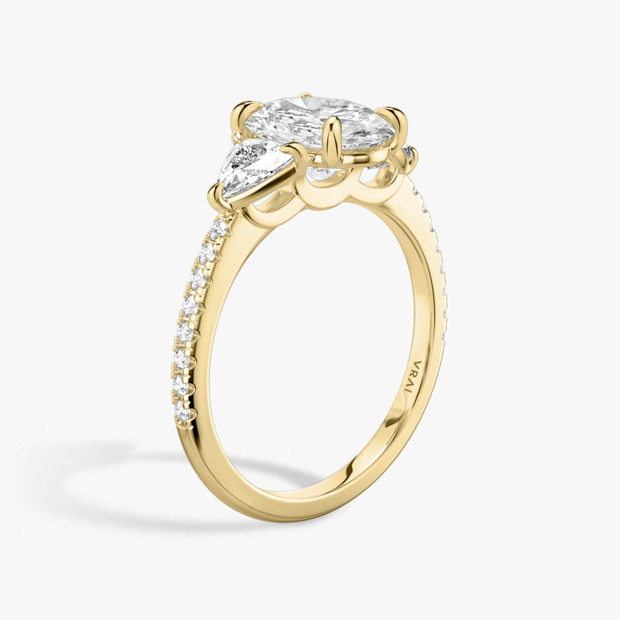 The Three Stone | Oval | 18k | Yellow Gold | bandAccent: Pavé | sideStoneCarat: 0.25ct | sideStoneShape: Trillion | diamondOrientation: vertical | caratWeight: other