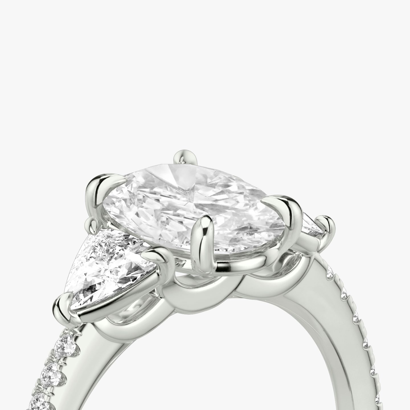 The Three Stone | Oval | 18k | White Gold | bandAccent: Pavé | sideStoneCarat: 0.25ct | sideStoneShape: Trillion | diamondOrientation: vertical | caratWeight: other