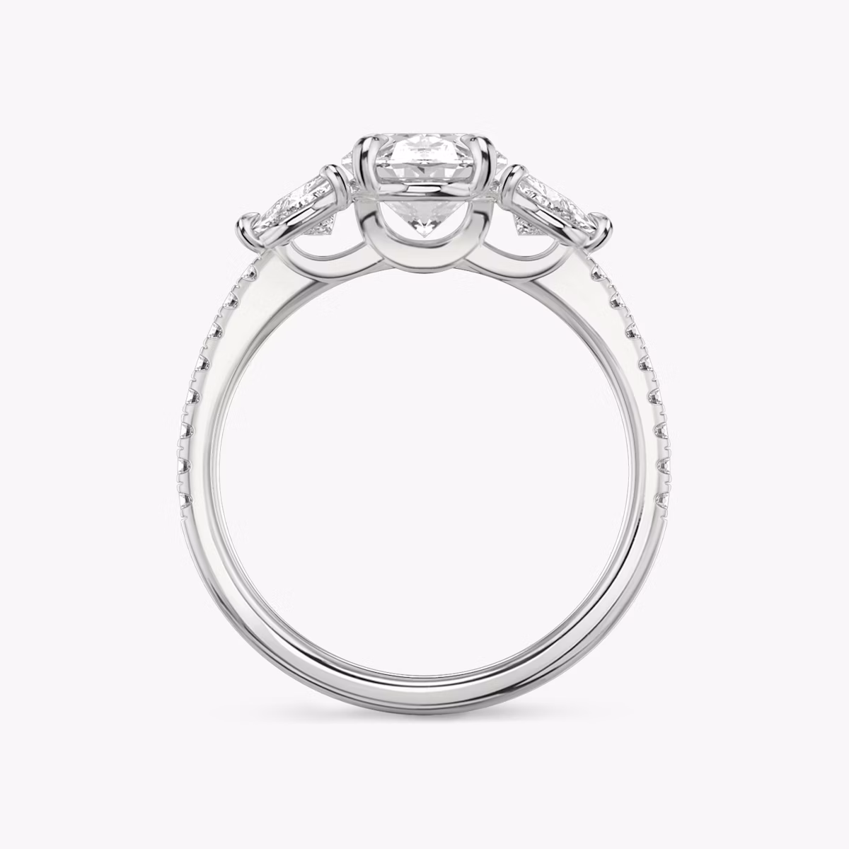 The Three Stone | Oval | 18k | White Gold | bandAccent: Pavé | sideStoneCarat: 0.25ct | sideStoneShape: Trillion | diamondOrientation: vertical | caratWeight: other