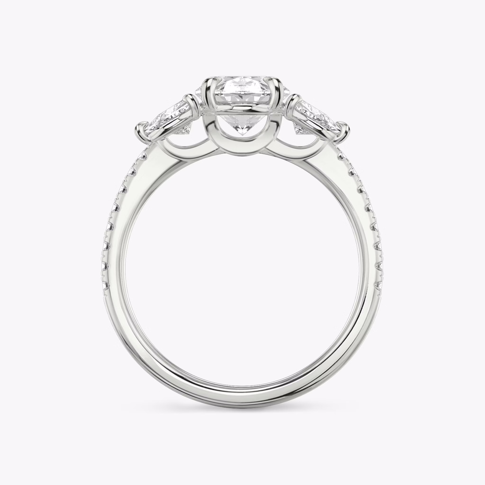 The Three Stone | Oval | 18k | White Gold | bandAccent: Pavé | sideStoneCarat: 0.25ct | sideStoneShape: Trillion | diamondOrientation: vertical | caratWeight: other