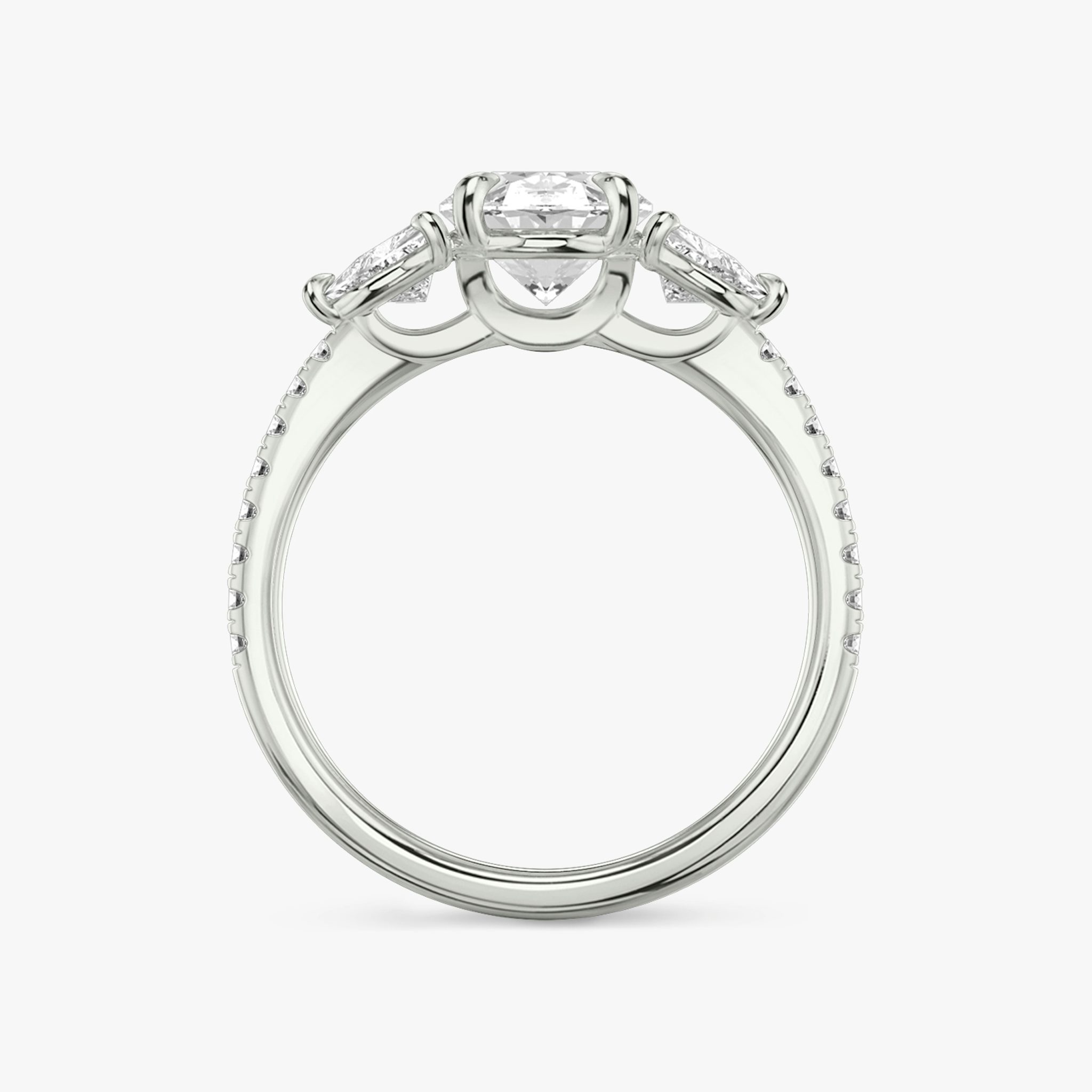 The Three Stone | Oval | 18k | White Gold | bandAccent: Pavé | sideStoneCarat: 0.25ct | sideStoneShape: Trillion | diamondOrientation: vertical | caratWeight: other