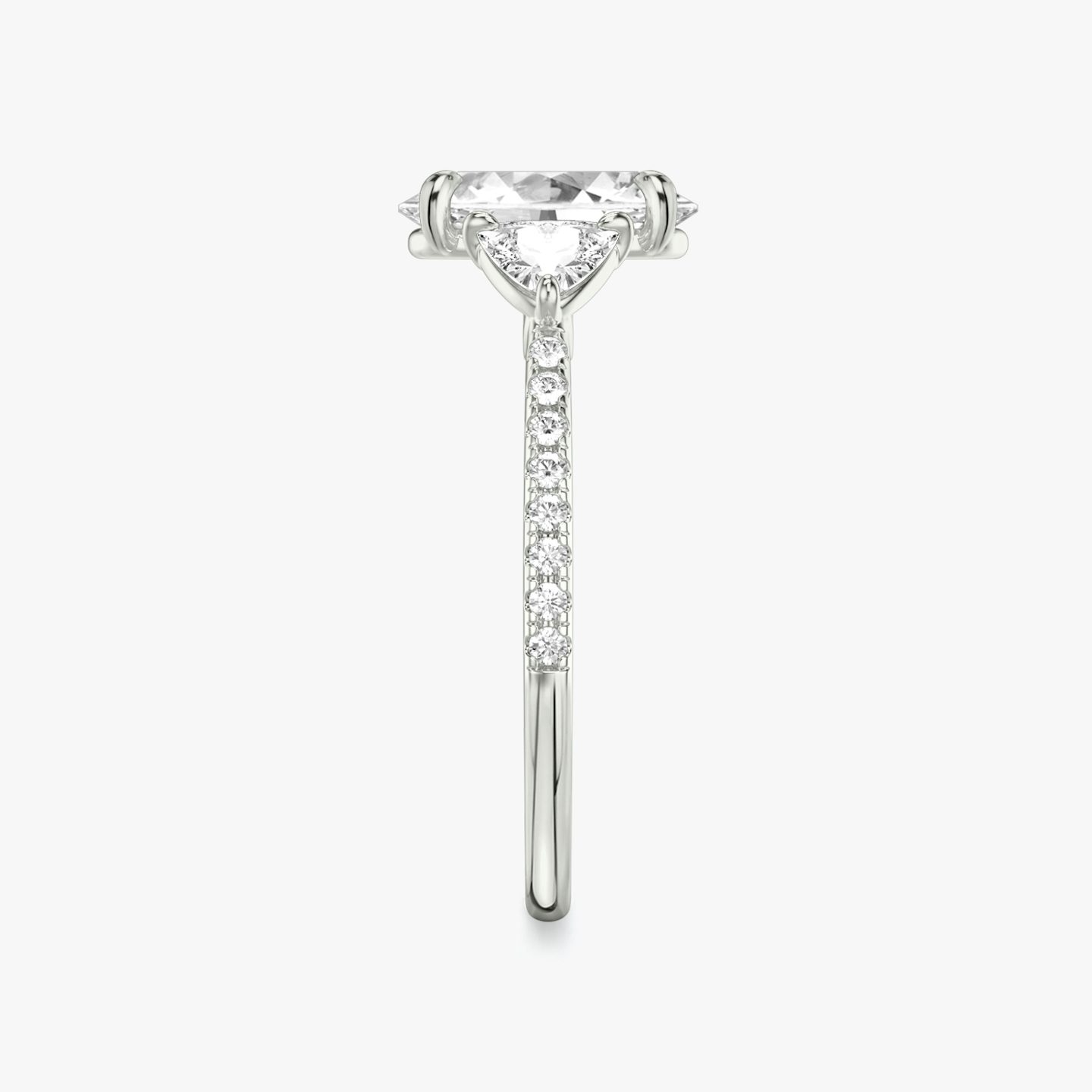 The Three Stone | Oval | 18k | White Gold | bandAccent: Pavé | sideStoneCarat: 0.25ct | sideStoneShape: Trillion | diamondOrientation: vertical | caratWeight: other