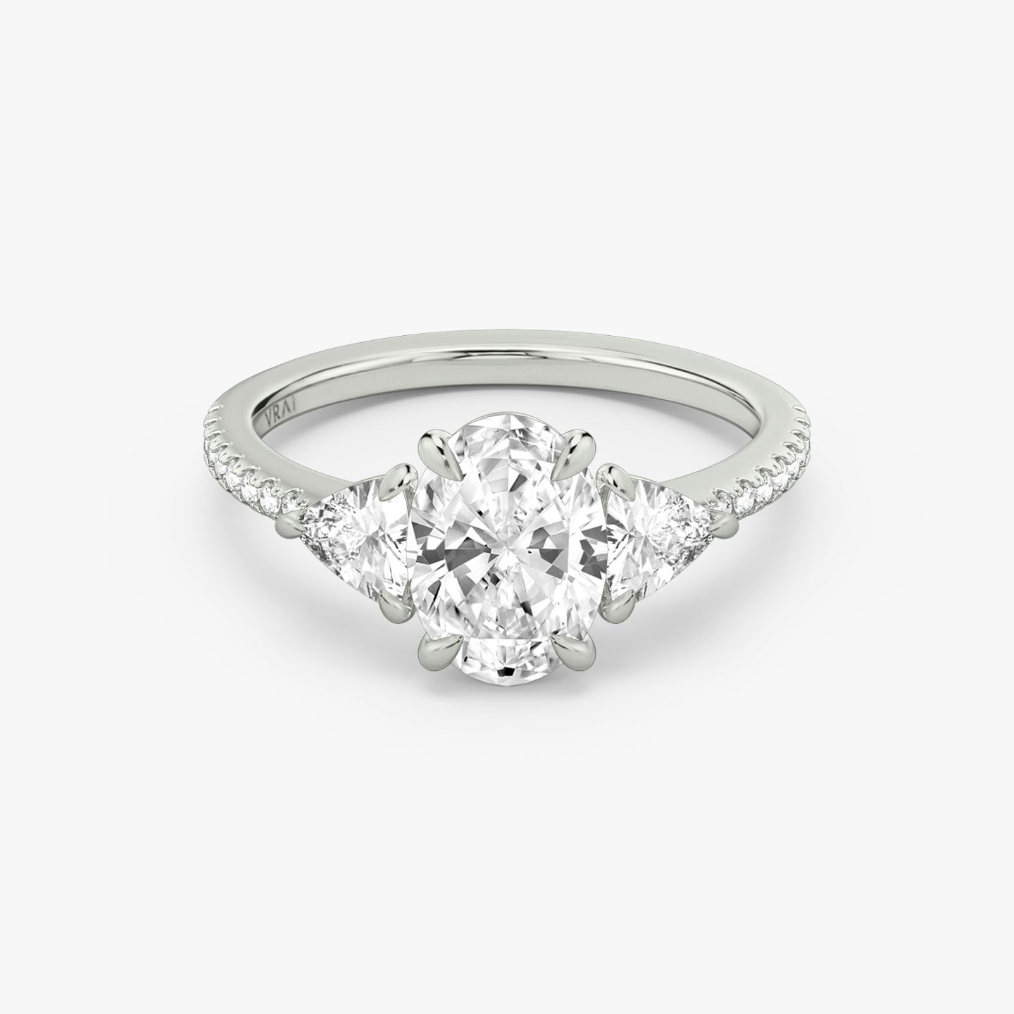 The Three Stone | Oval | Platinum | bandAccent: Pavé | sideStoneCarat: 0.25ct | sideStoneShape: Trillion | diamondOrientation: vertical | caratWeight: other
