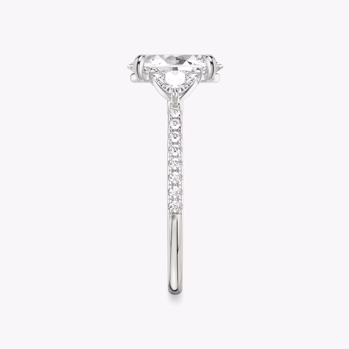 The Three Stone | Oval | Platinum | bandAccent: Pavé | sideStoneCarat: 0.25ct | sideStoneShape: Trillion | diamondOrientation: vertical | caratWeight: other
