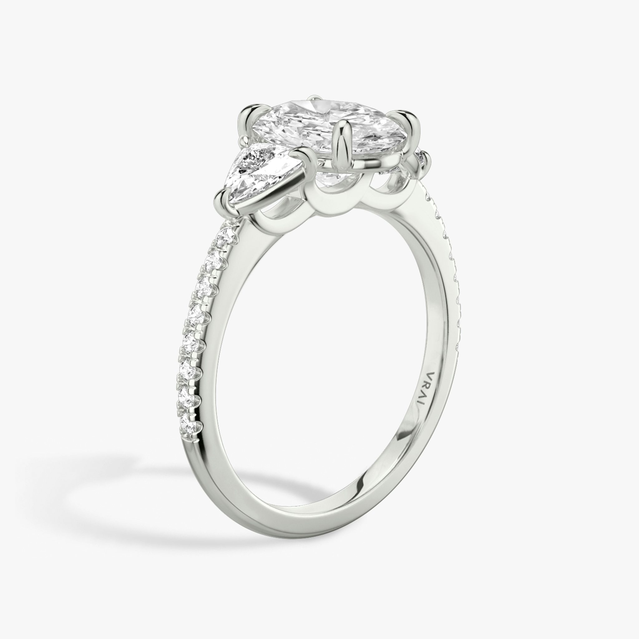 The Three Stone | Oval | Platinum | bandAccent: Pavé | sideStoneCarat: 0.25ct | sideStoneShape: Trillion | diamondOrientation: vertical | caratWeight: other