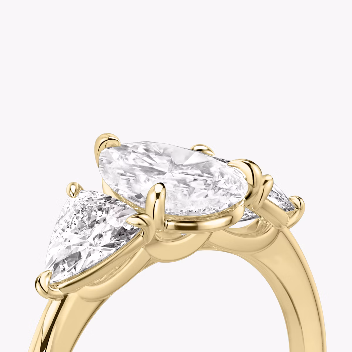 The Three Stone | Pear | 18k | Yellow Gold | bandAccent: Plain | sideStoneCarat: 0.50ct | sideStoneShape: Trillion | diamondOrientation: vertical | caratWeight: other
