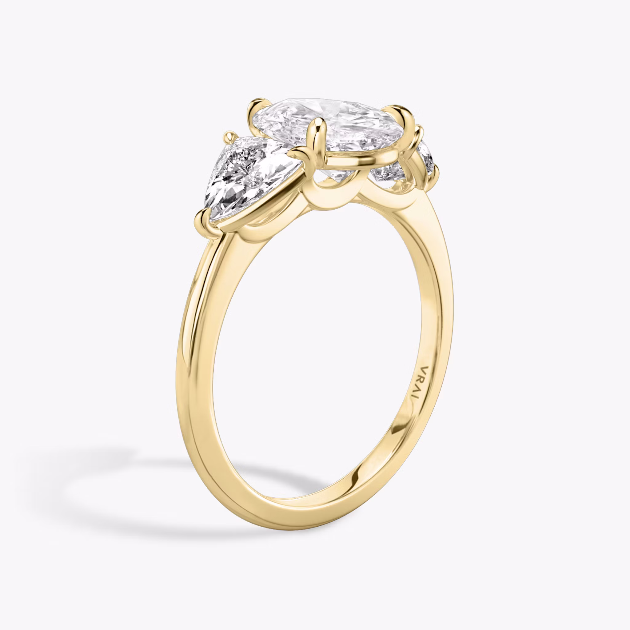 The Three Stone | Pear | 18k | Yellow Gold | bandAccent: Plain | sideStoneCarat: 0.50ct | sideStoneShape: Trillion | diamondOrientation: vertical | caratWeight: other
