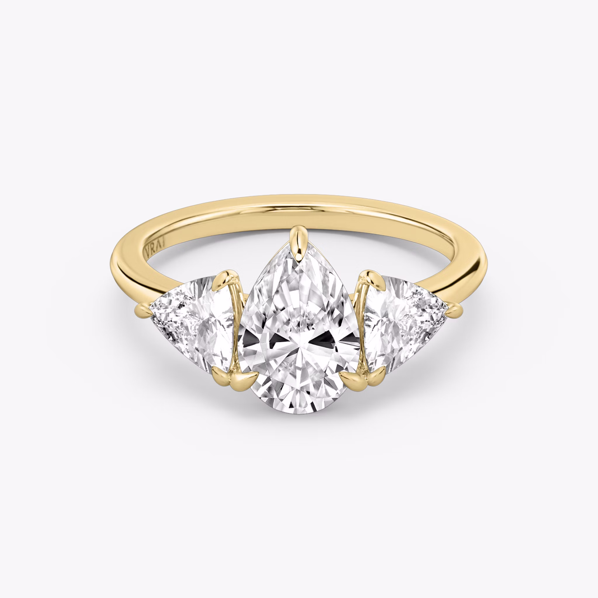 The Three Stone | Pear | 18k | Yellow Gold | bandAccent: Plain | sideStoneCarat: 0.50ct | sideStoneShape: Trillion | diamondOrientation: vertical | caratWeight: other